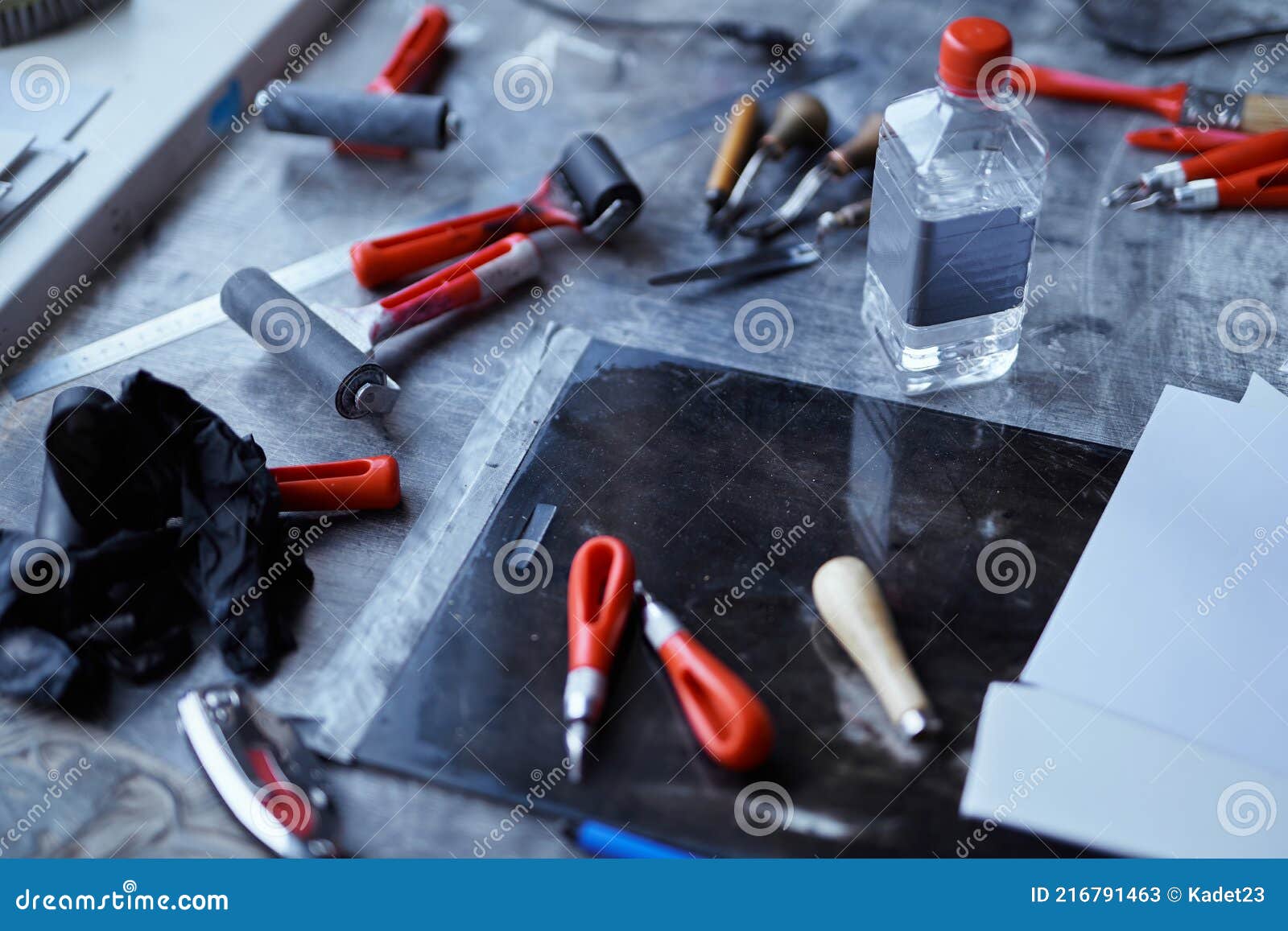 Group of Linocut Tools on Dark Table. Lithography Concept Stock