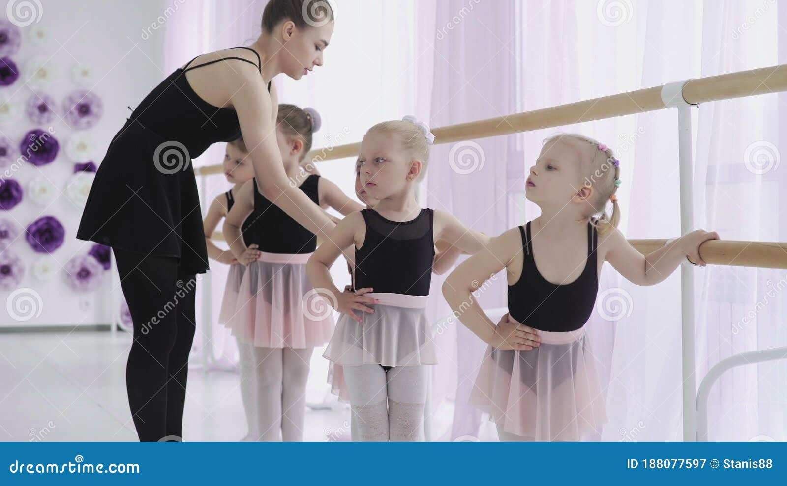 Group Of Little Girls Learning New Dance Moves During Ballet Lesson