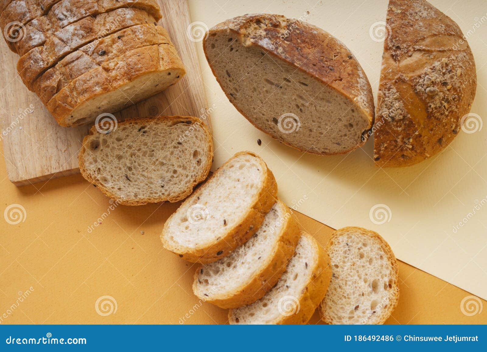 Group of Many Type of Bread on a Plate and Cooking Flour Stock Photo