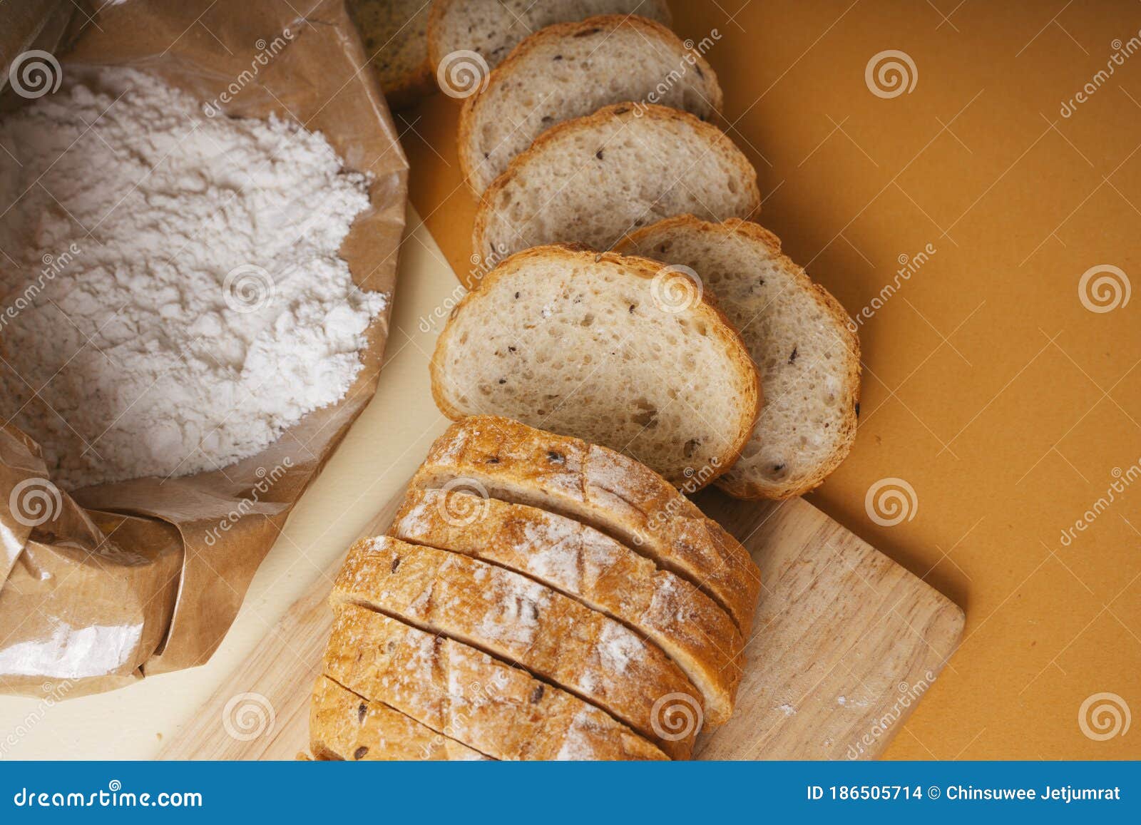 Group of Many Type of Bread on a Plate and Cooking Flour Stock Photo