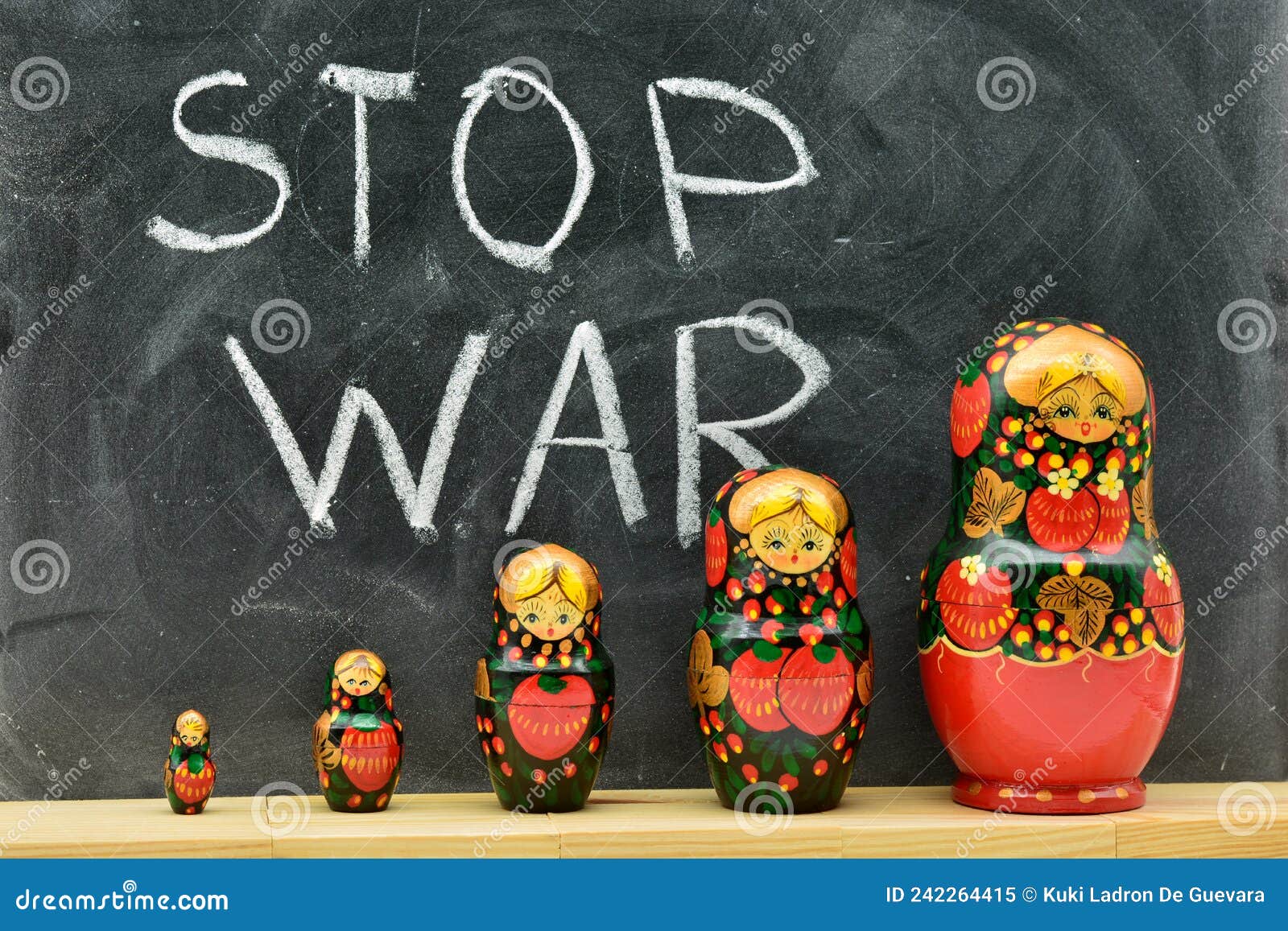 group of matryoshka dolls with the background of a blackboard