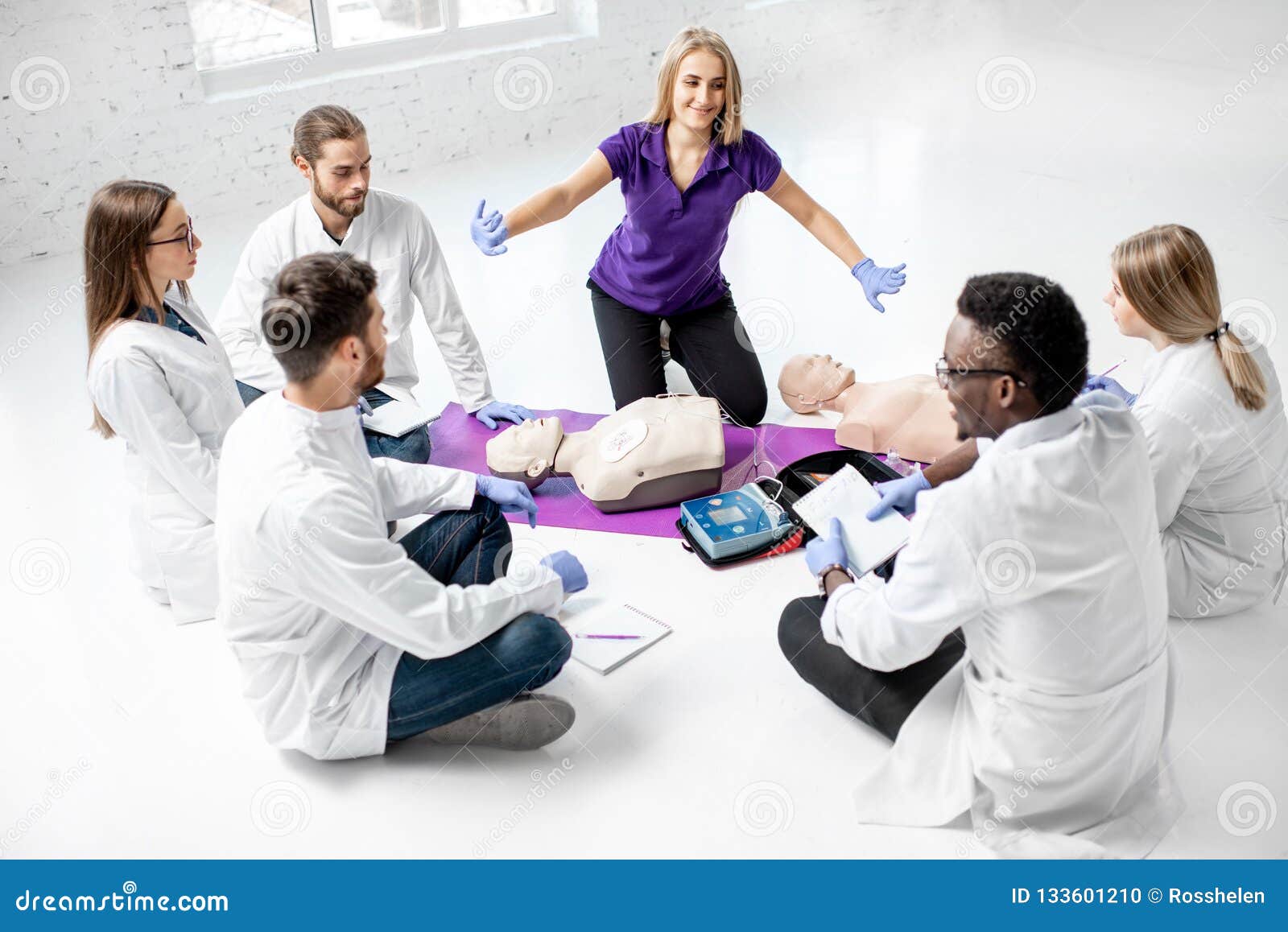 Group of Medics during the First Aid Training Indoors Stock Photo