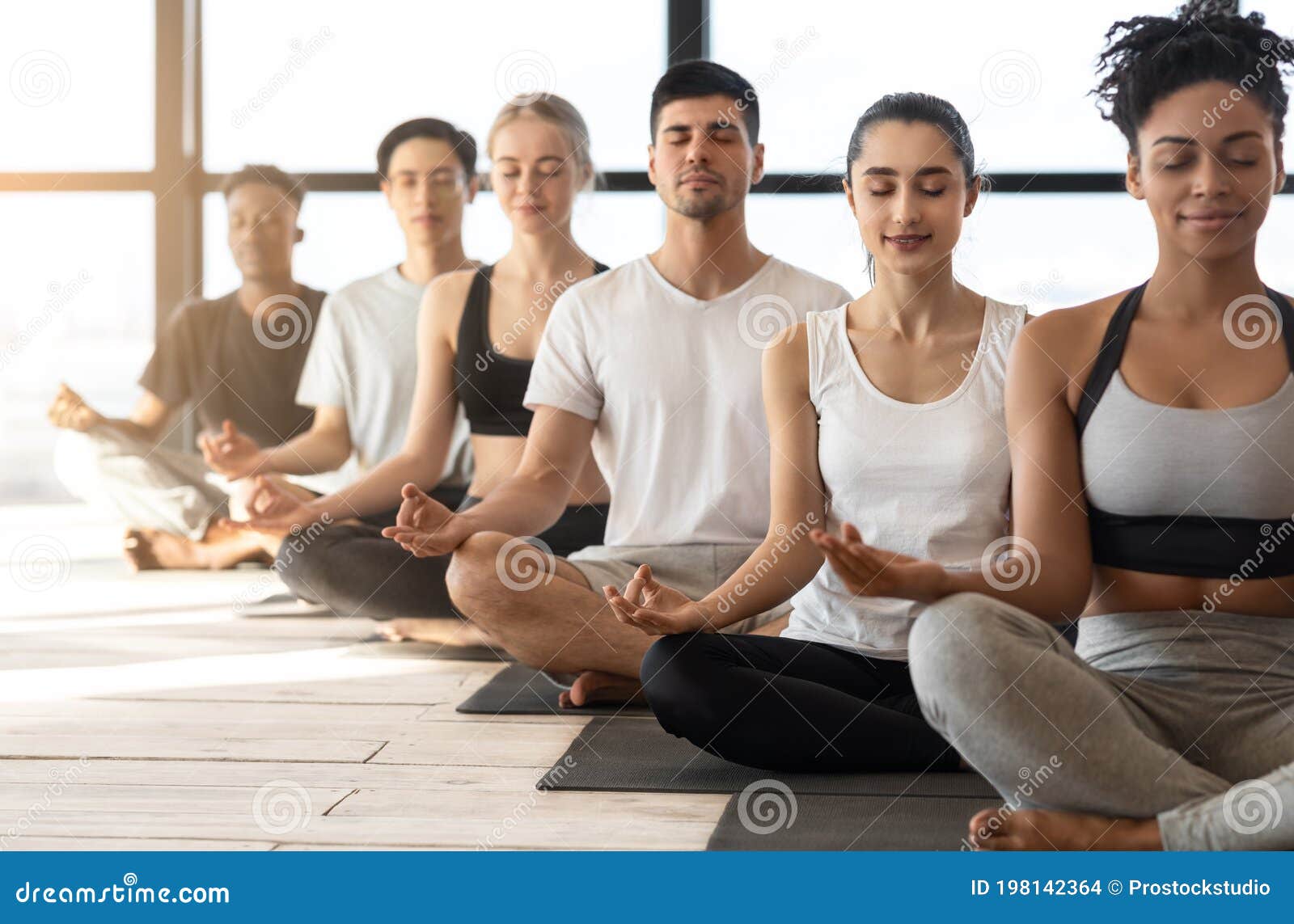 Group Meditation Sporty Multiracial Men And Women