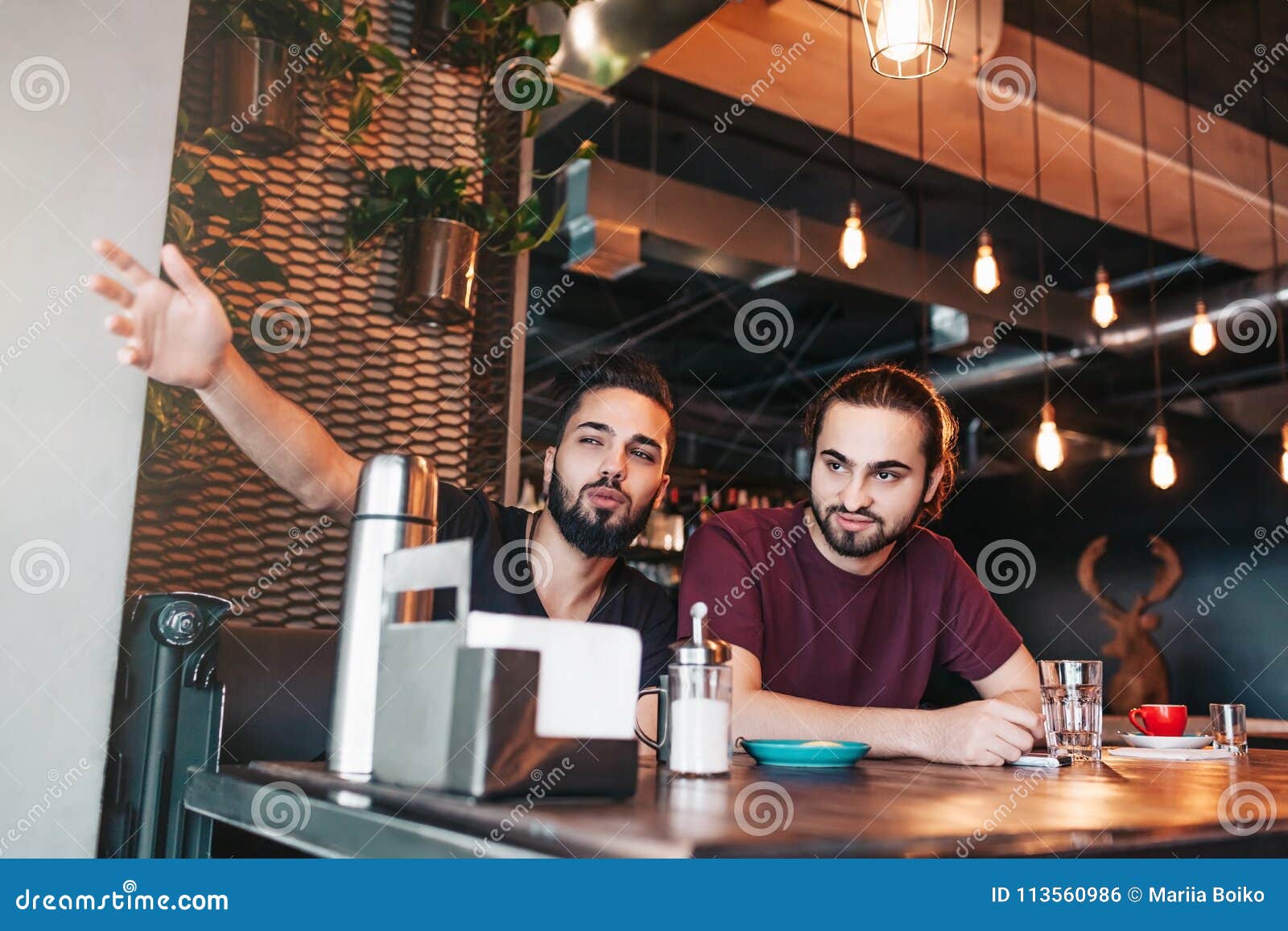 Group of Mixed Race Young Men Talking in Lounge Bar. Multiracial ...