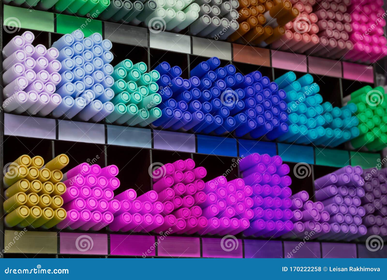 group of multicolored felt-tip pens as school, colledge and university tools on shells. colorful pencils for drawing