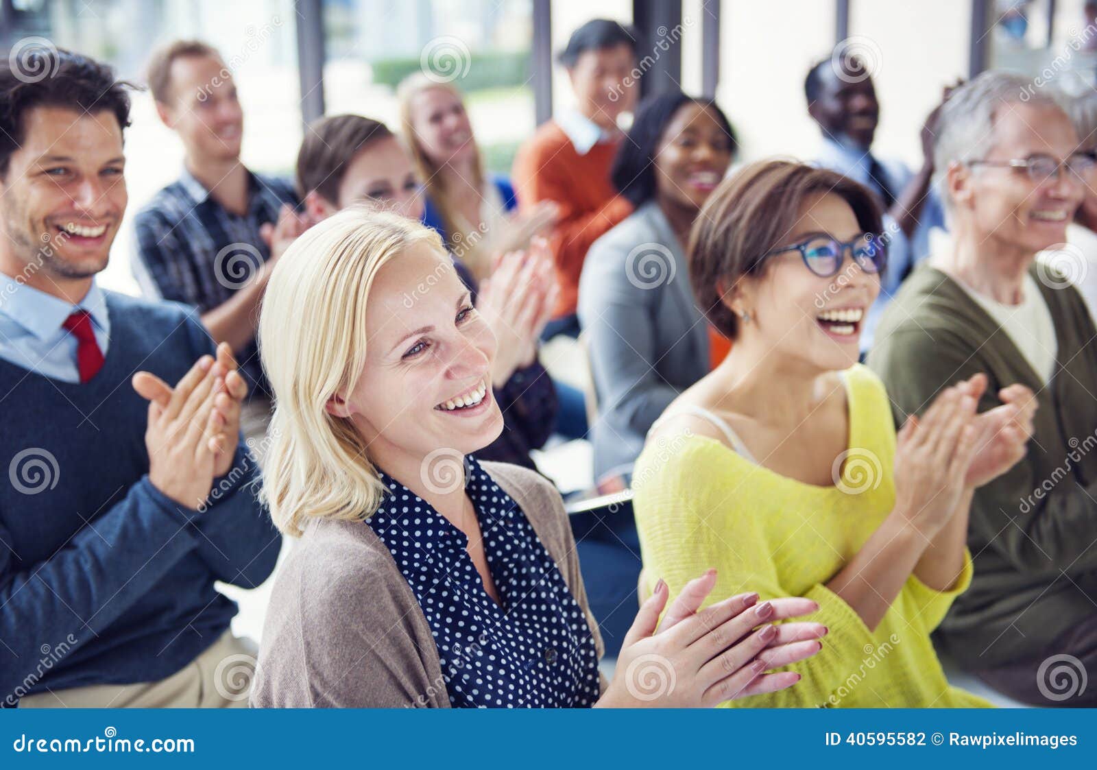 group of multiethnic cheerful people applauding