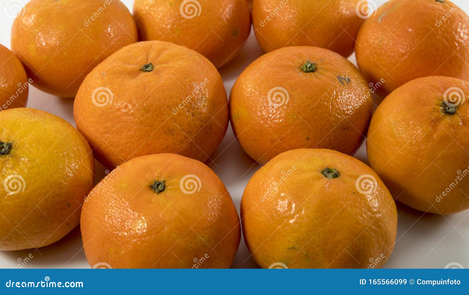 Group of orange mandarins stock image. Image of food 165566099