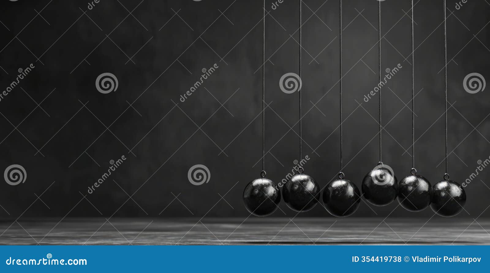 a group of pendulums hanging from strings. ideal for science and physics 