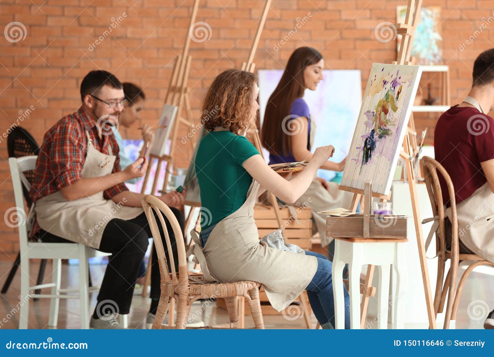 group of people during classes in school of painters