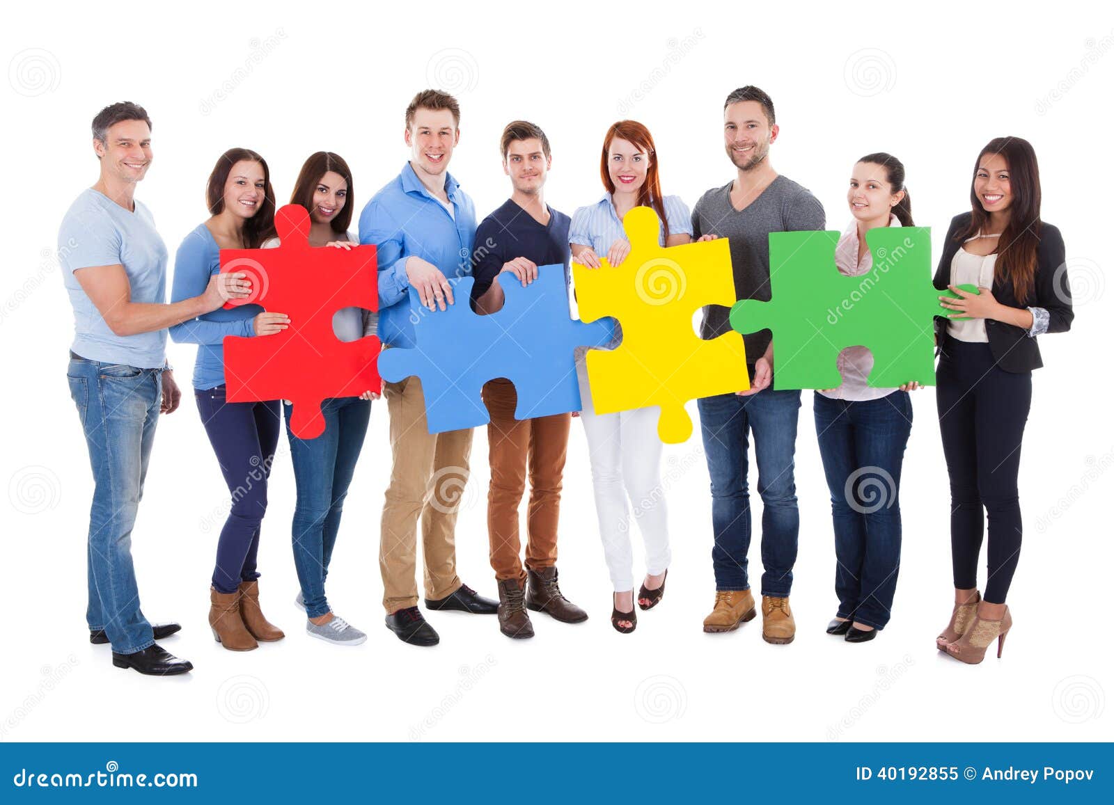 group of people connecting puzzle pieces