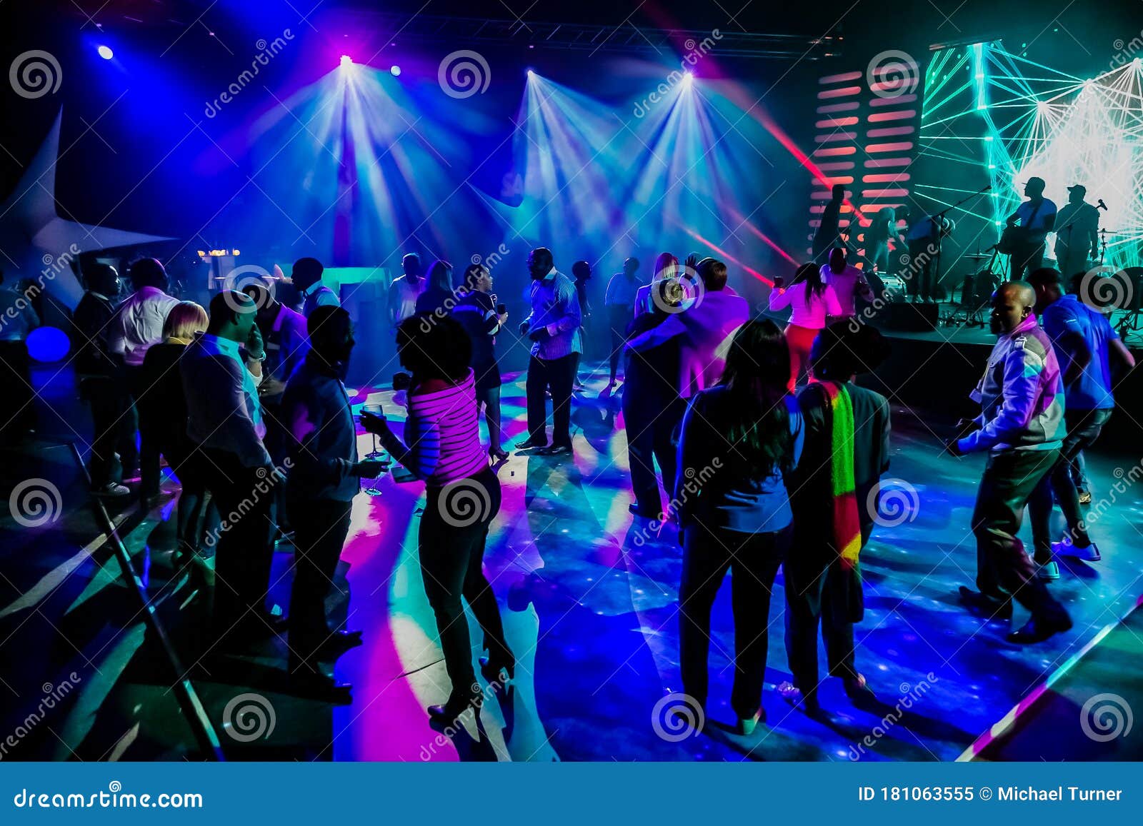 Group of People Dancing on a Dance Floor in Dark Night Club Environment ...