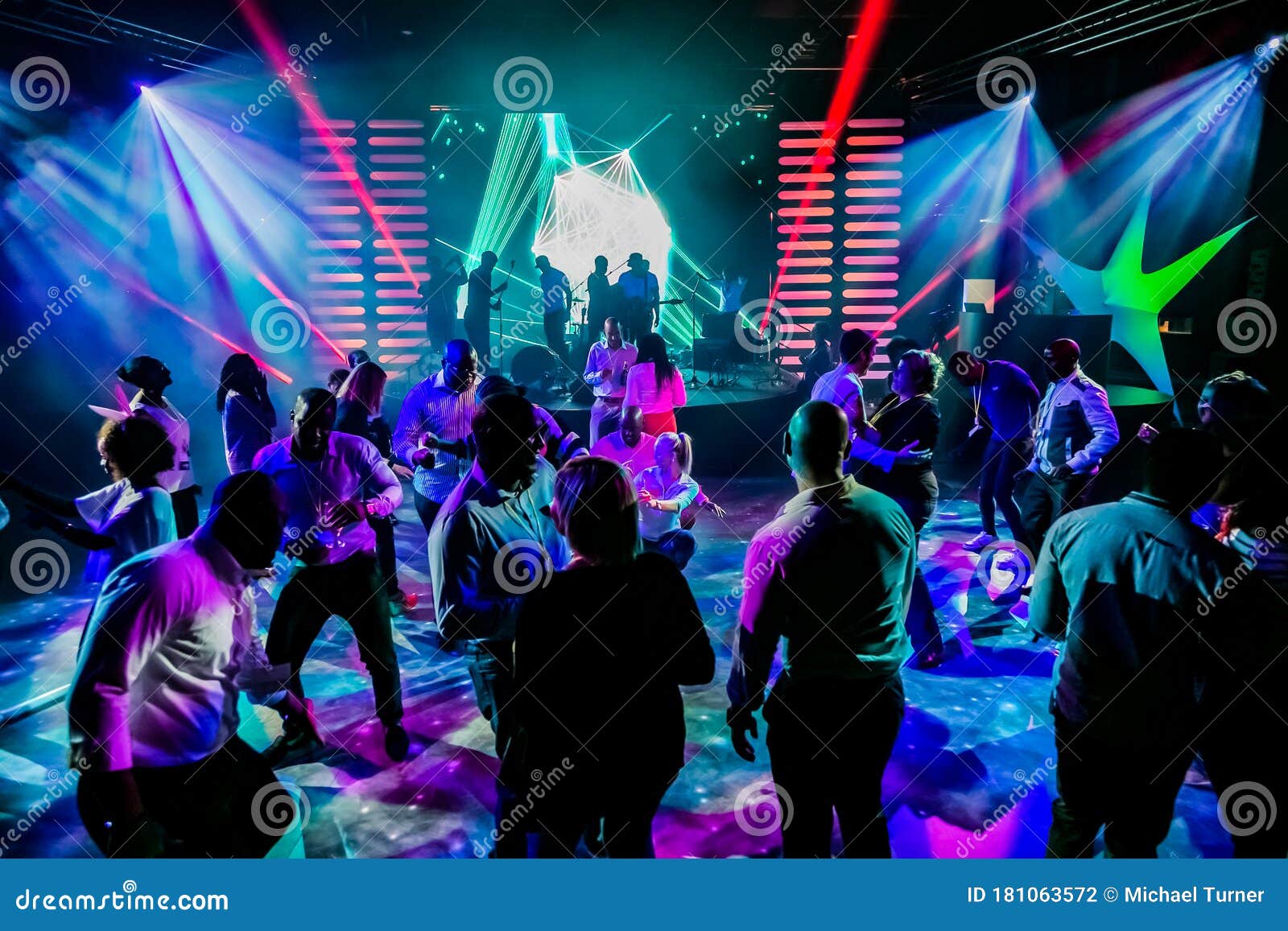 Group of People Dancing on a Dance Floor in Dark Night Club Environment ...