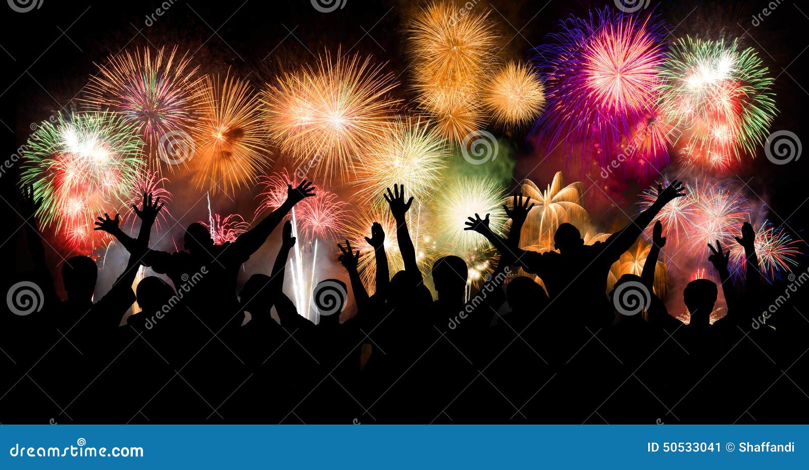 group of people enjoying spectacular fireworks show in a carnival or holiday