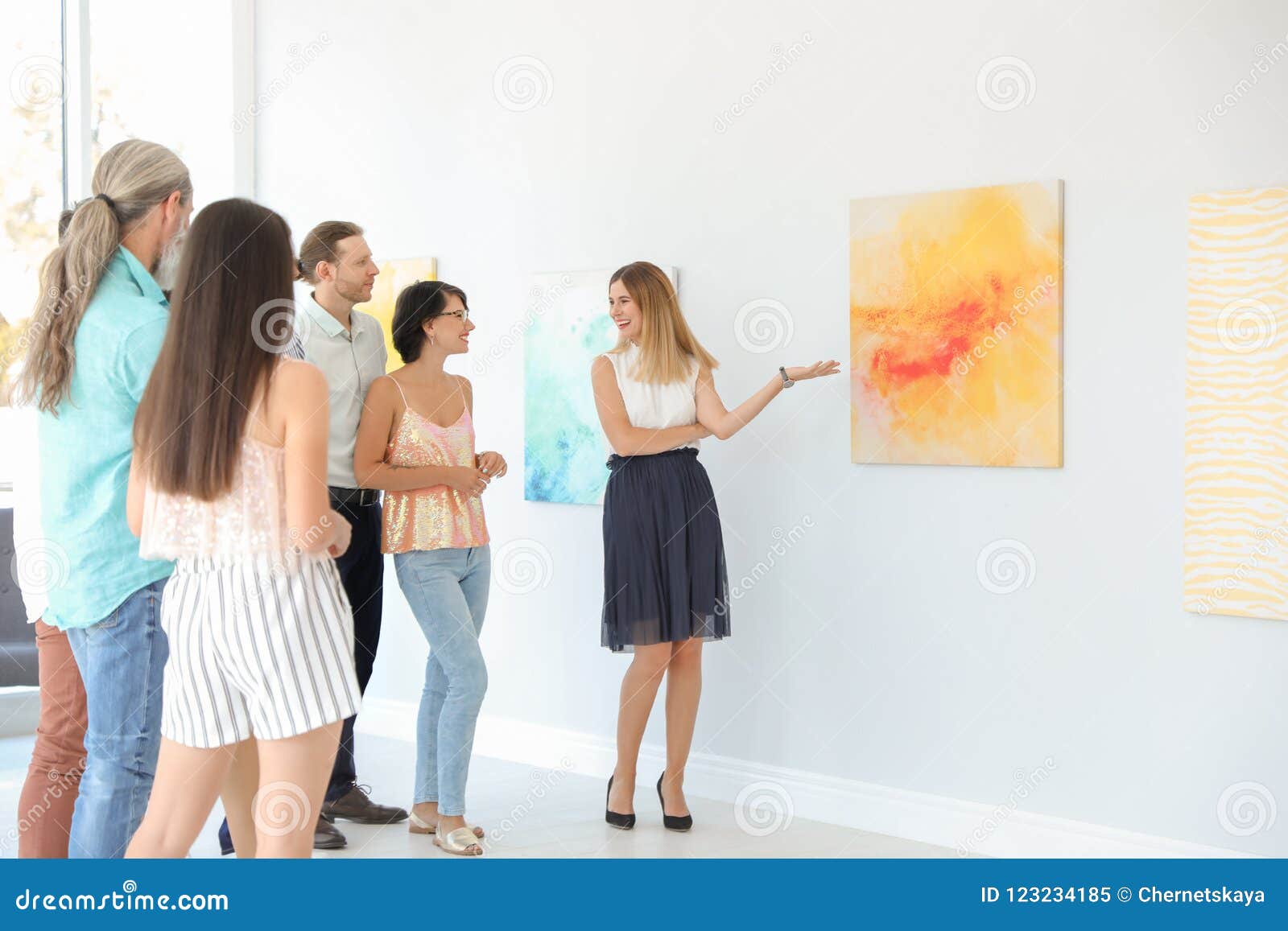 Group of People with Guide at Exhibition Stock Image Image of artwork