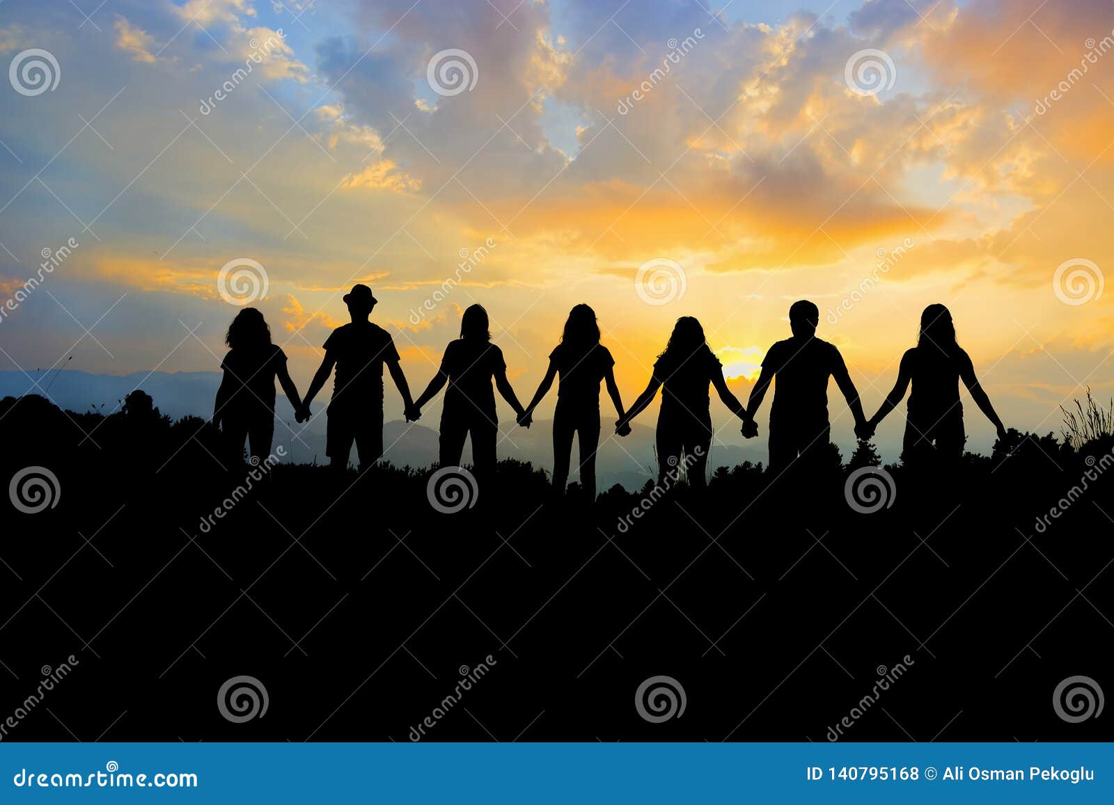 group of people holding hands team unity