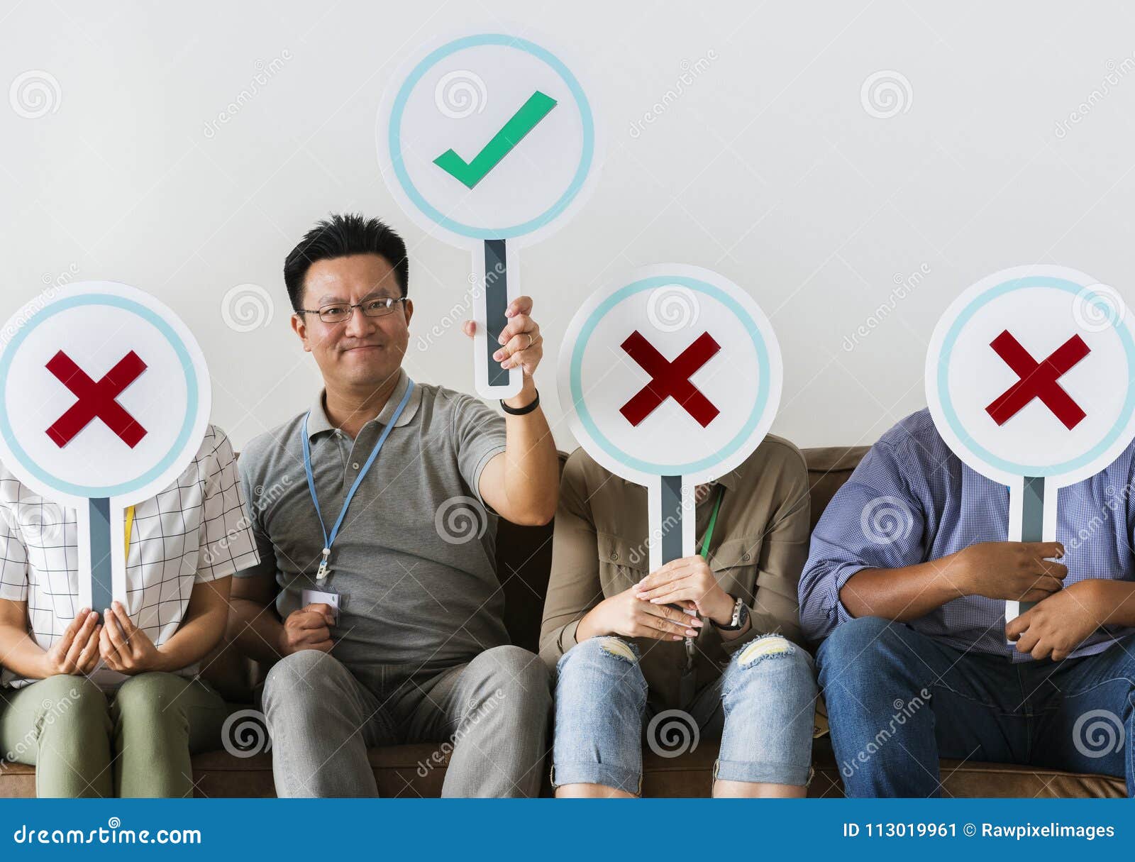 group of people holding true & false icons