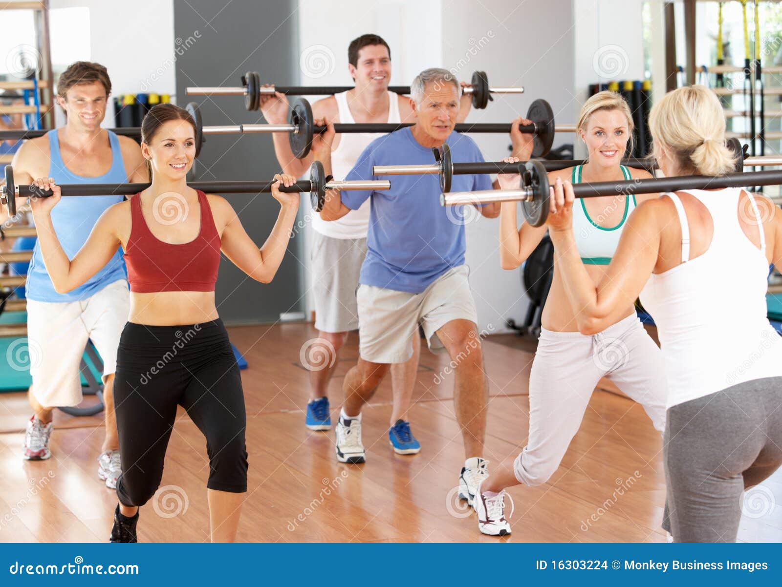 group of people lifting weights
