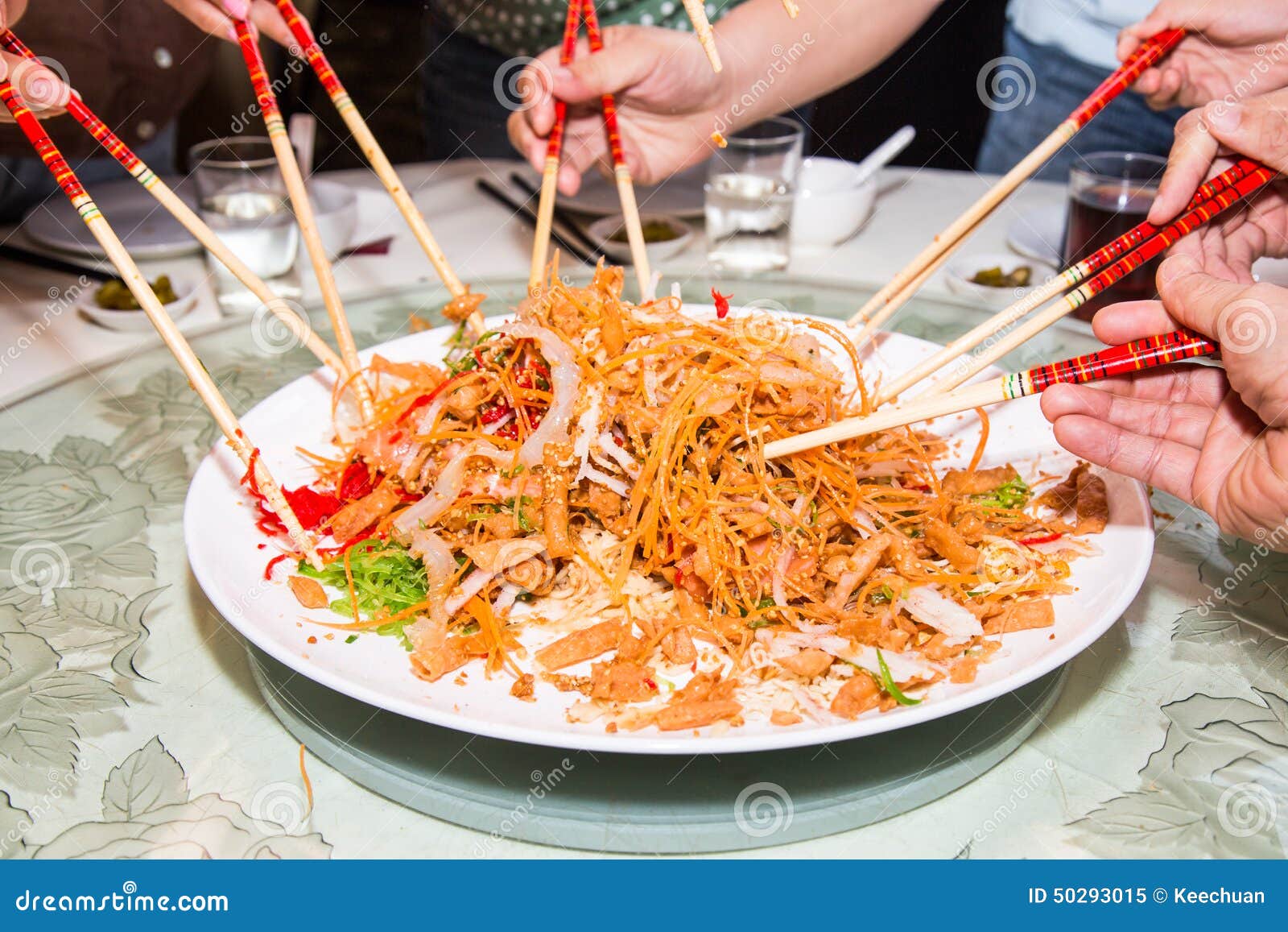 new year mixing dish a of mixing and tossing yee sang dish with new year mixing dish a of mixing and tossing yee sang dish with