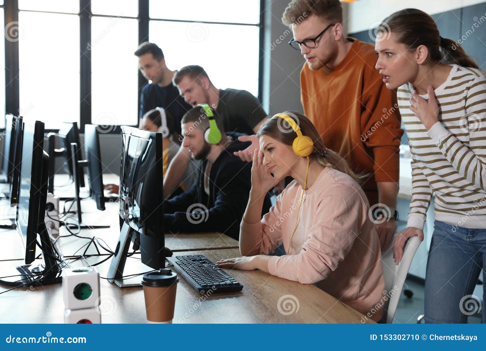 Group of People Playing Video Games in Cafe Stock Photo - Image of