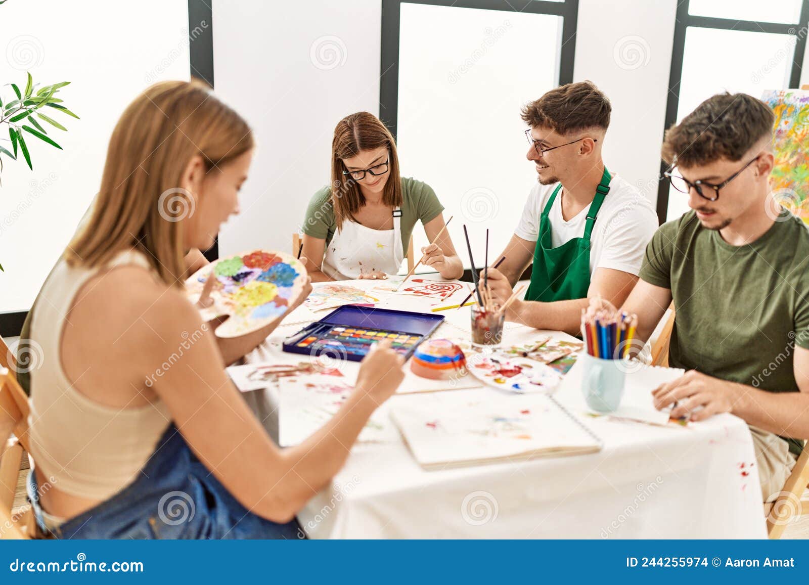 Group of People Sitting on the Table Drawing at Art Studio Stock Photo