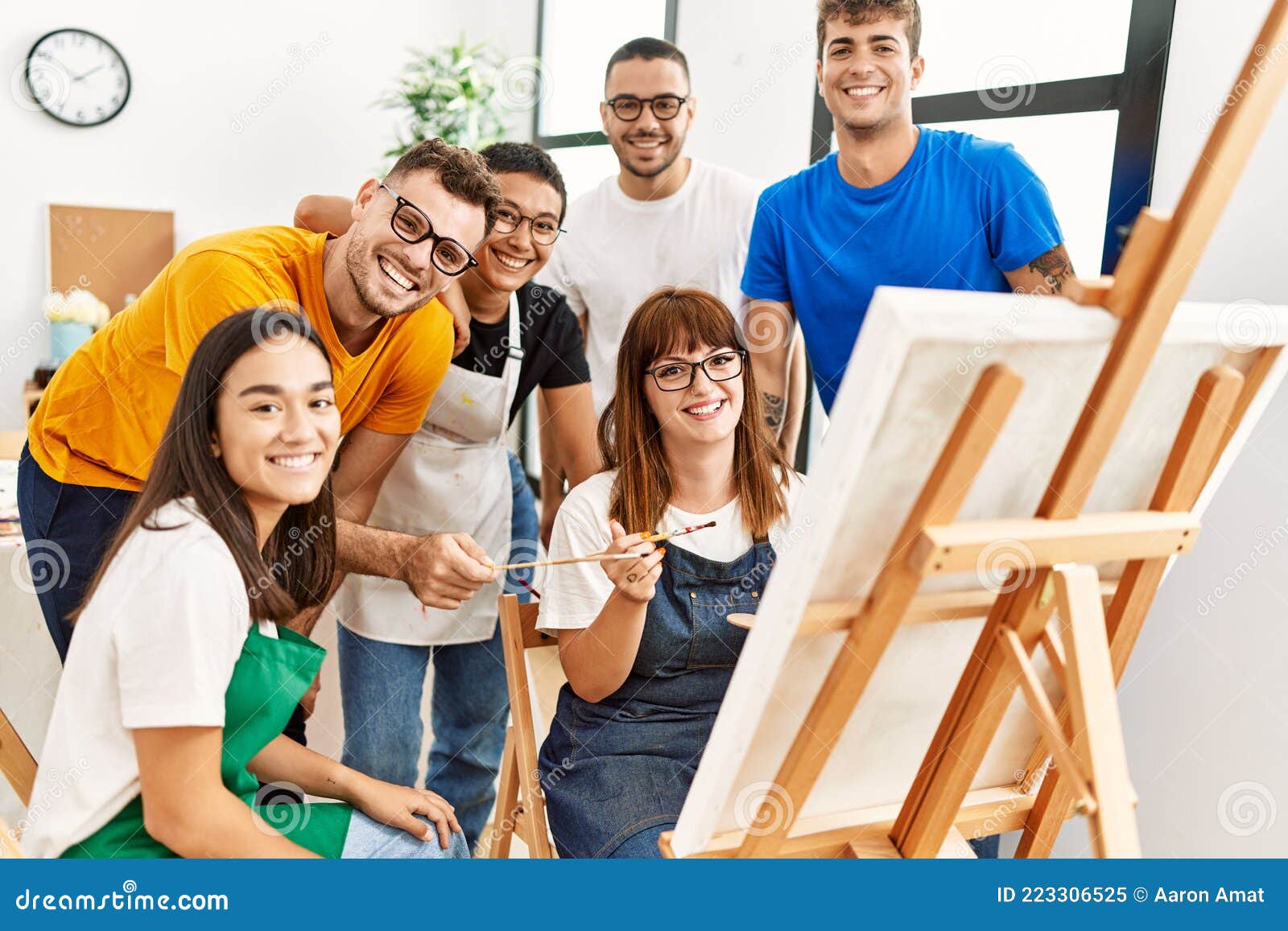 Young Caucasian People In An Art Gallery Looking At Paintings And Talking  About Them Stock Photo, Picture and Royalty Free Image. Image 22573792.