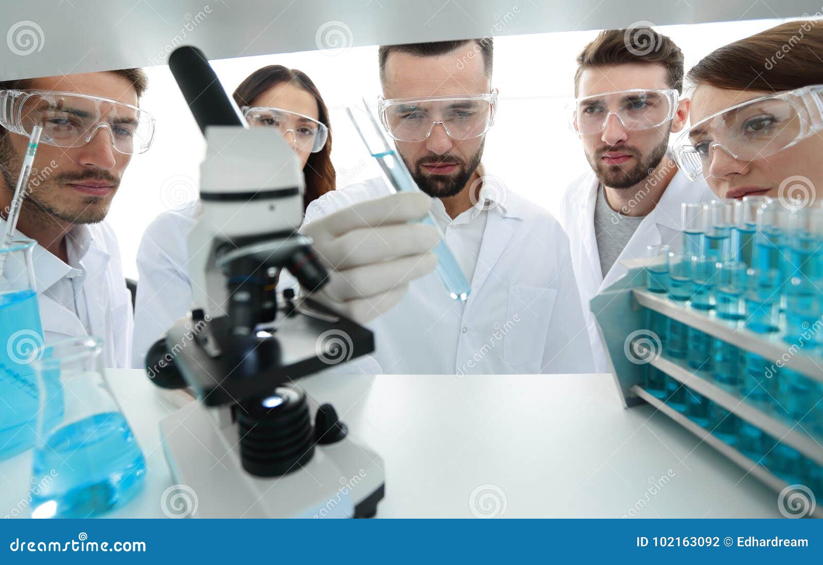 Group of Pharmacists Working in the Laboratory. Stock Photo Image of
