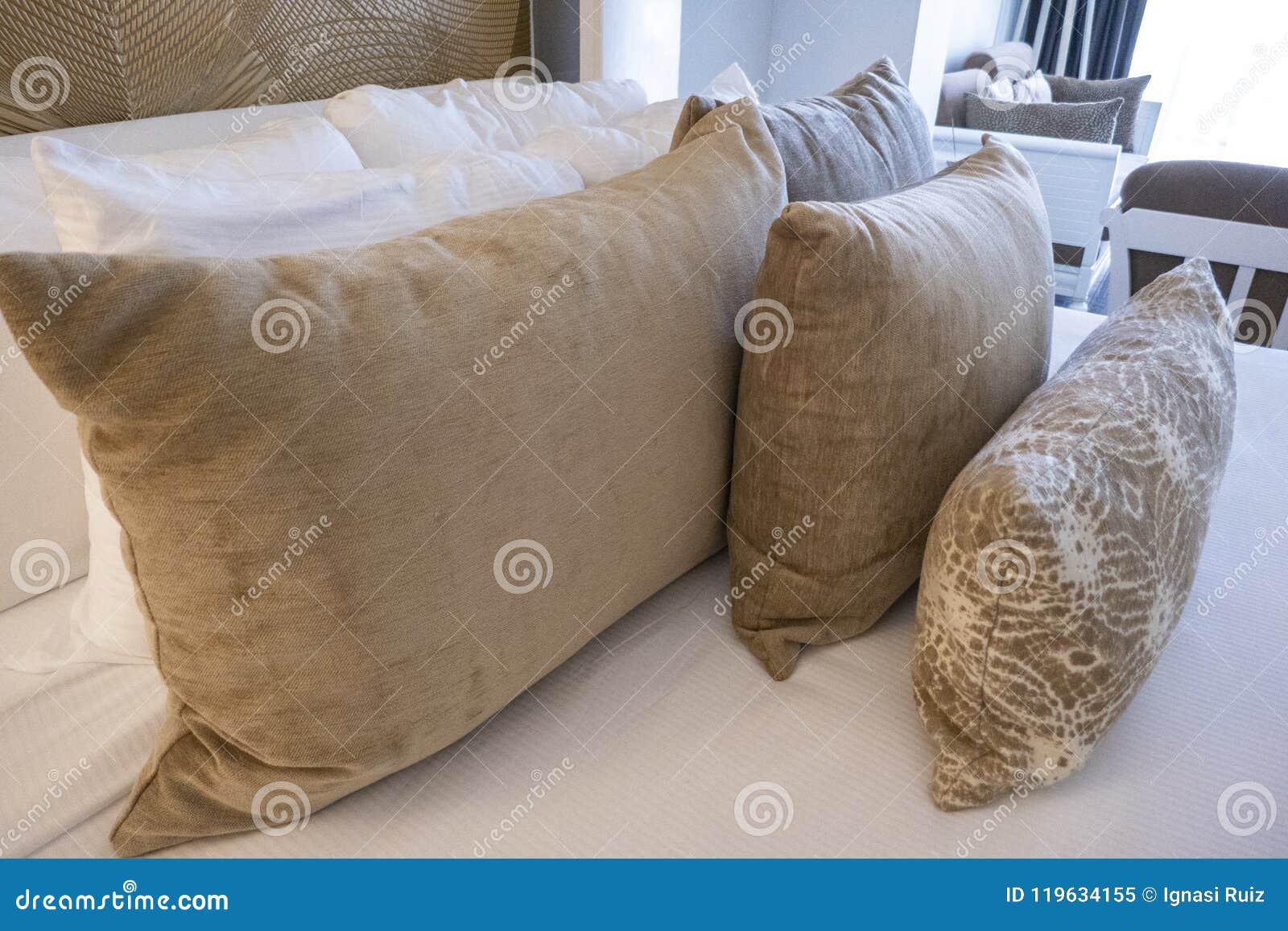 Group of pillows in a bed stock image. Image of interior 119634155