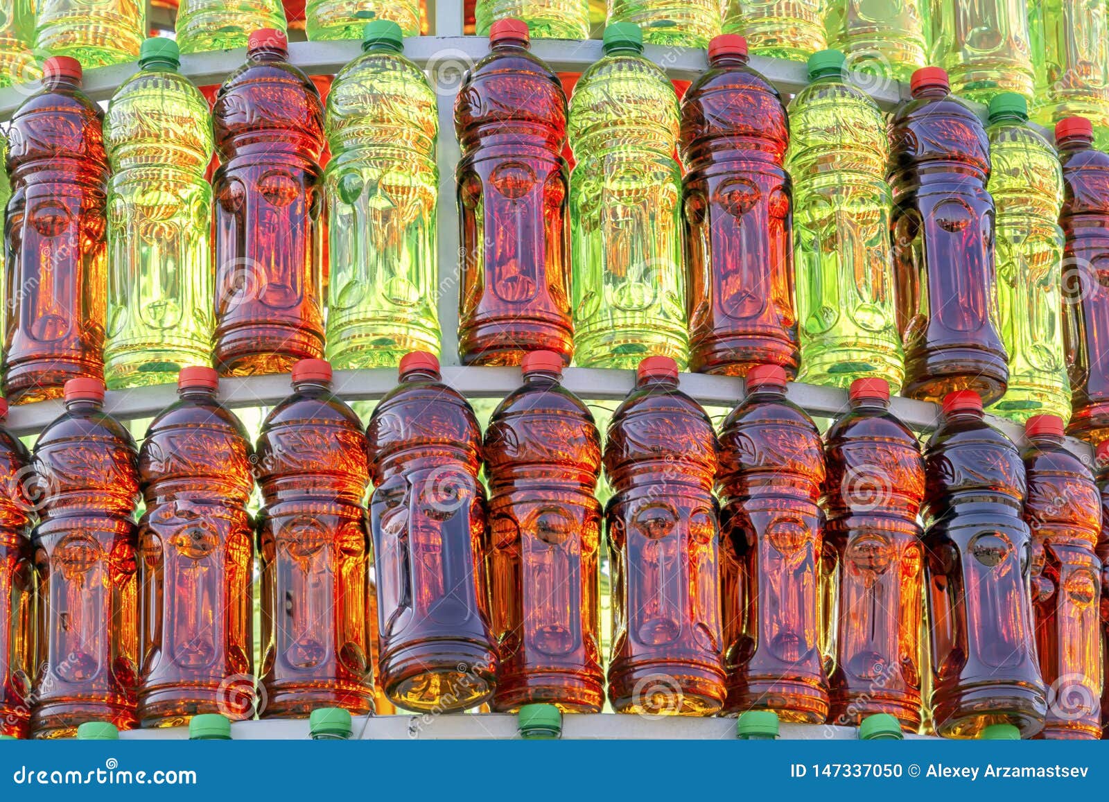 Group of Plastic Bottles of Red and Green Color Lined Up in Pyramid ...