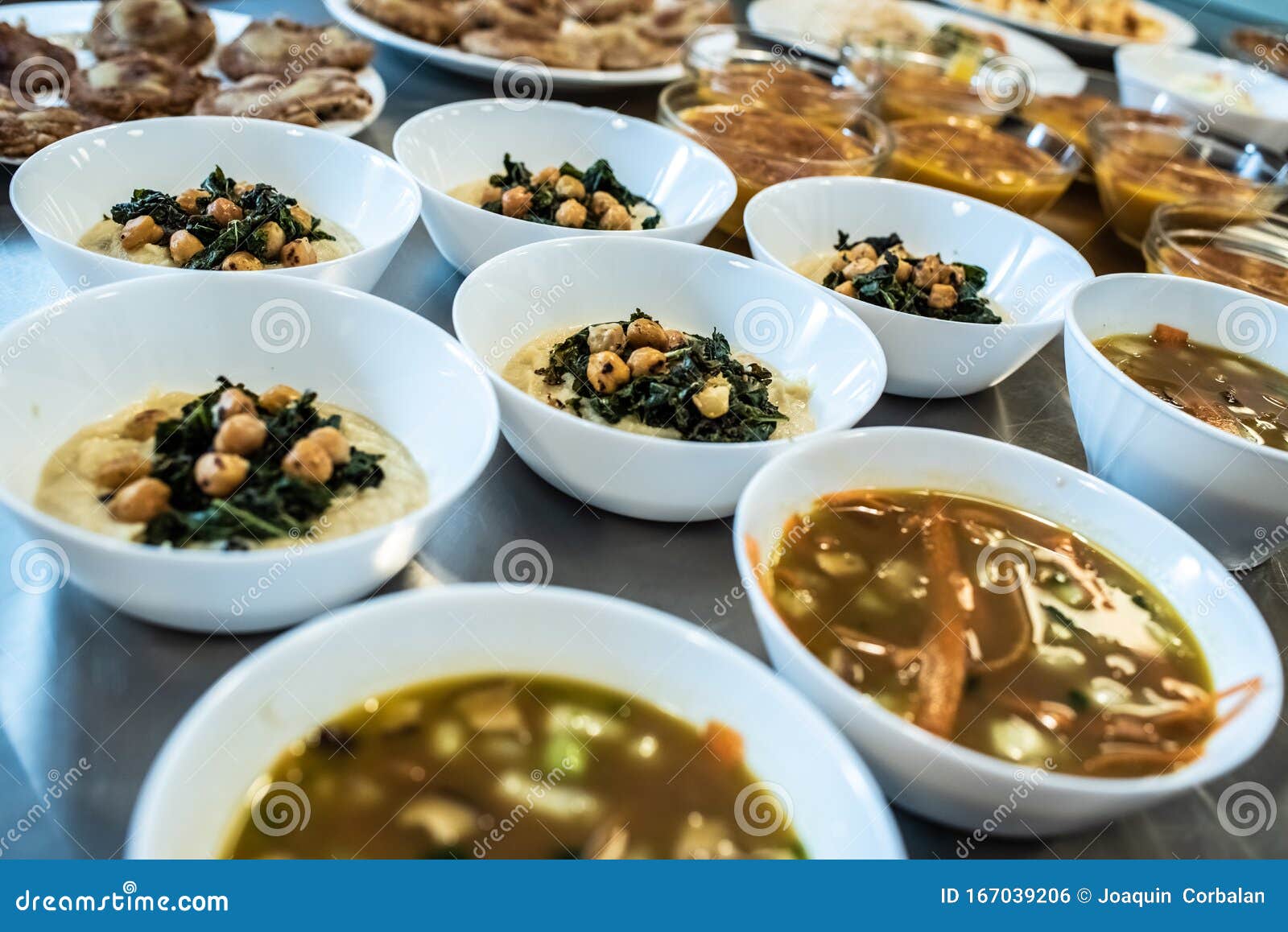 Group of Plates with Soups of Various Types in Hot Bowls Stock Photo