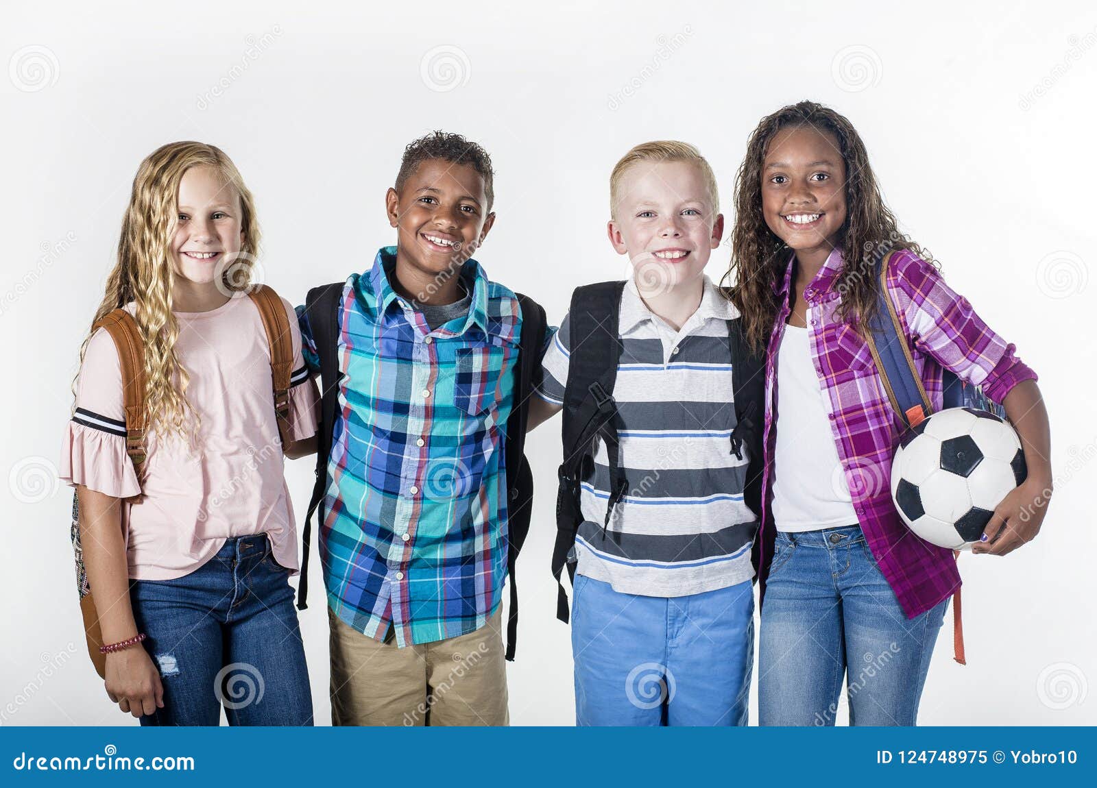 group portrait of pre-adolescent school kids smiling on a white background