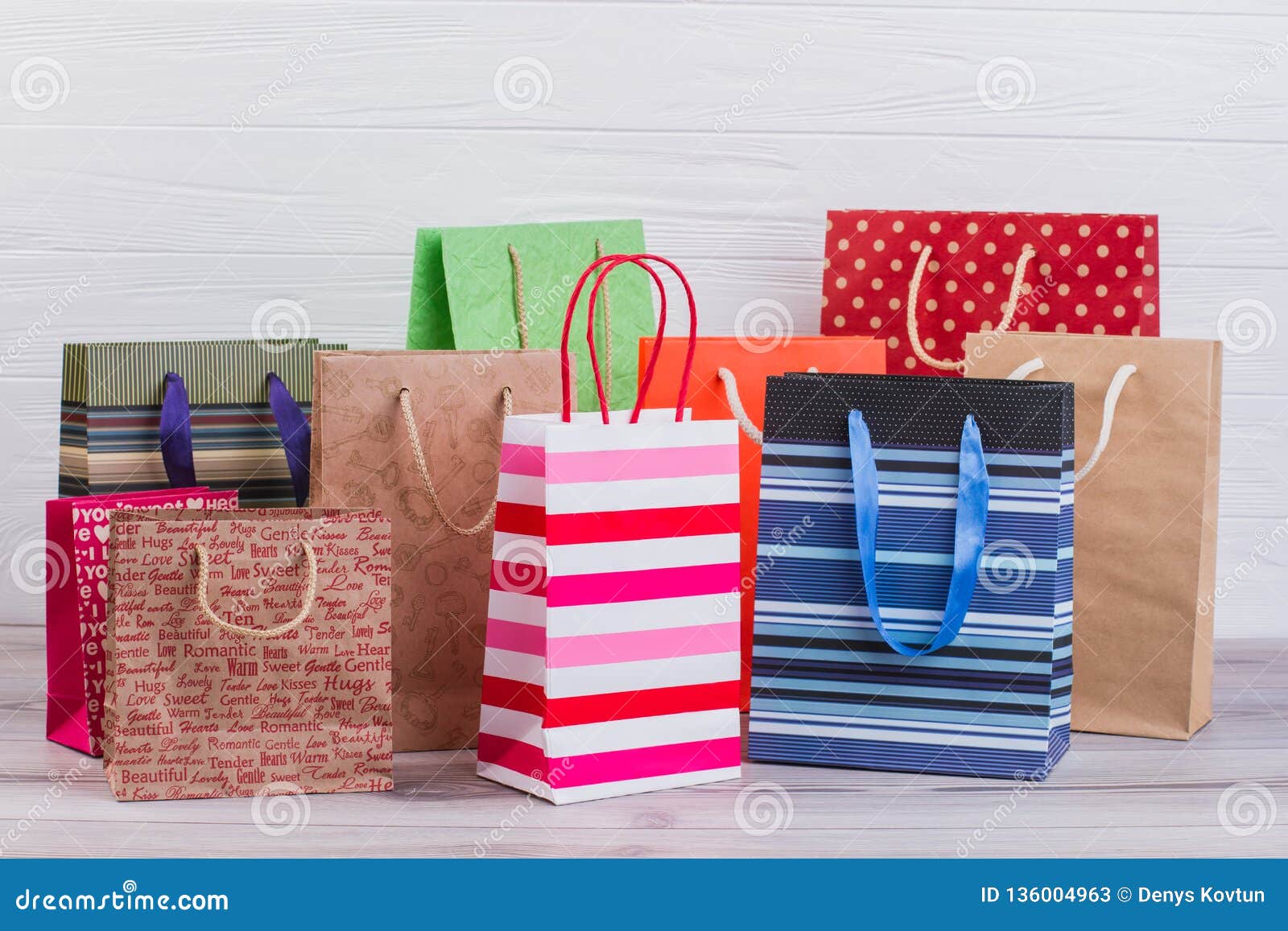 group of printed paper shopping bags.