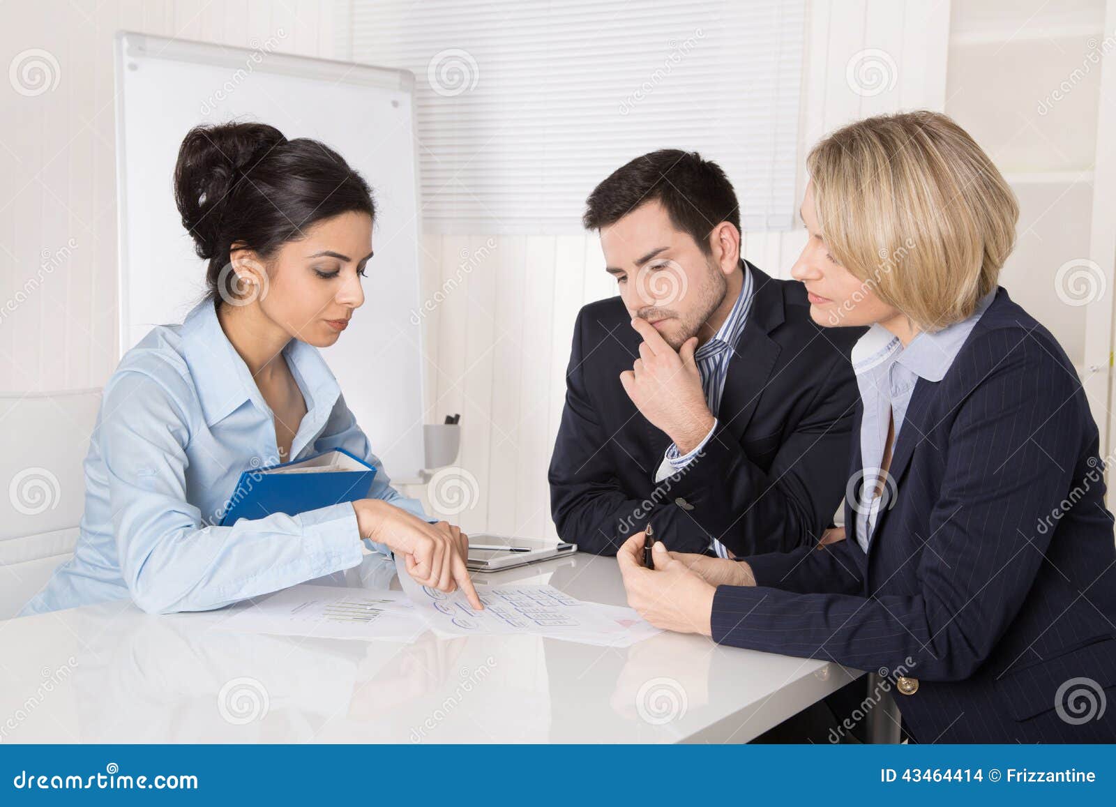 group professional business team sitting table talki talking together male female people wearing blue clothes 43464414