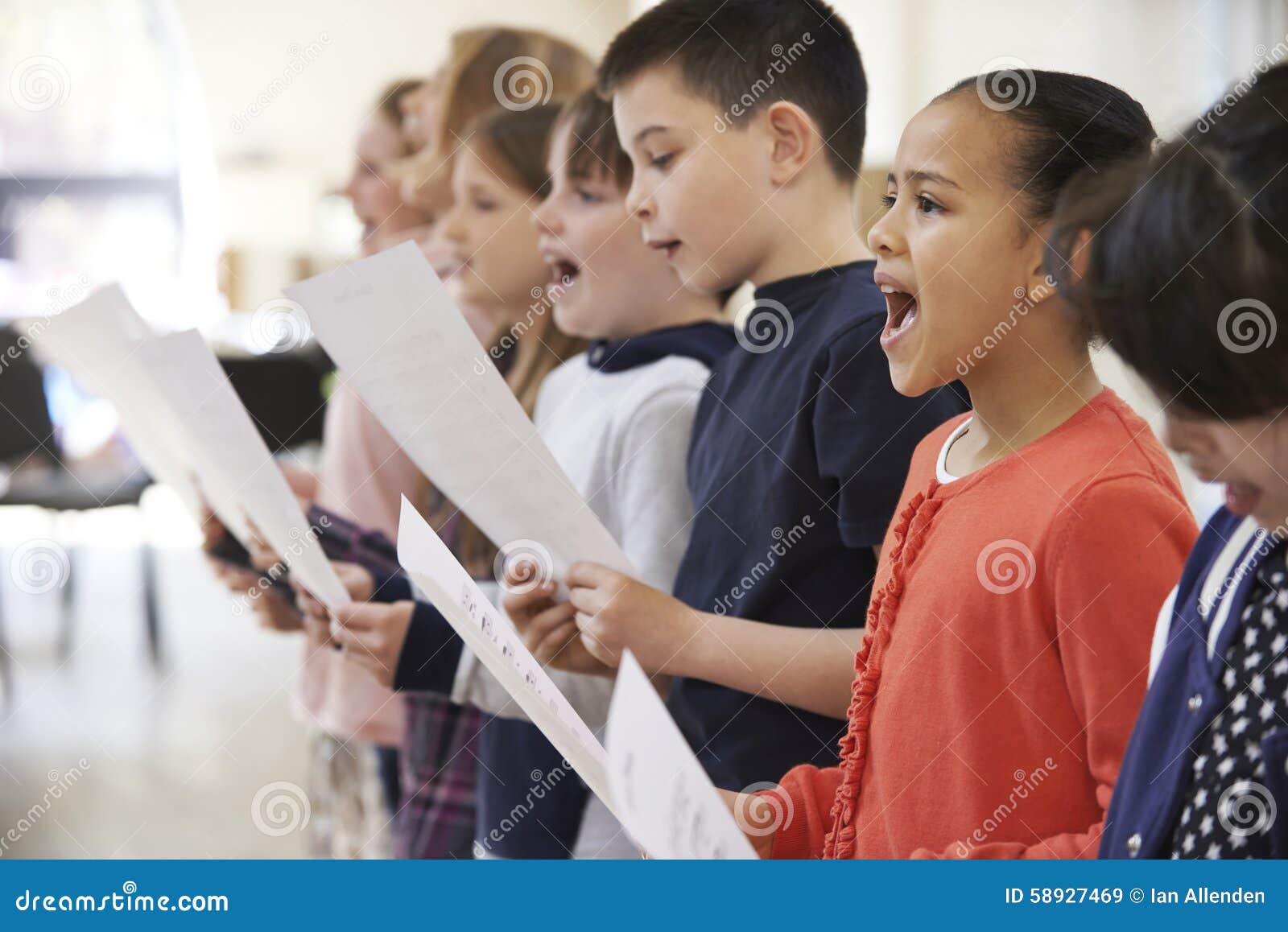 group of school children singing in choir together