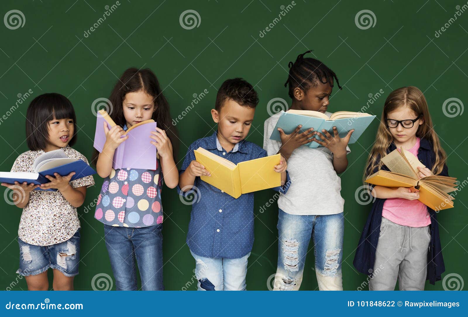 group of school kids reading for education