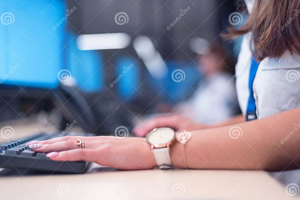 Group of Security Guards Working on Computers while Sitting in the Main ...