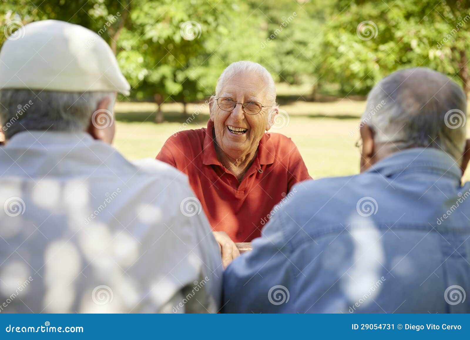 group of senior men having fun and laughing in park
