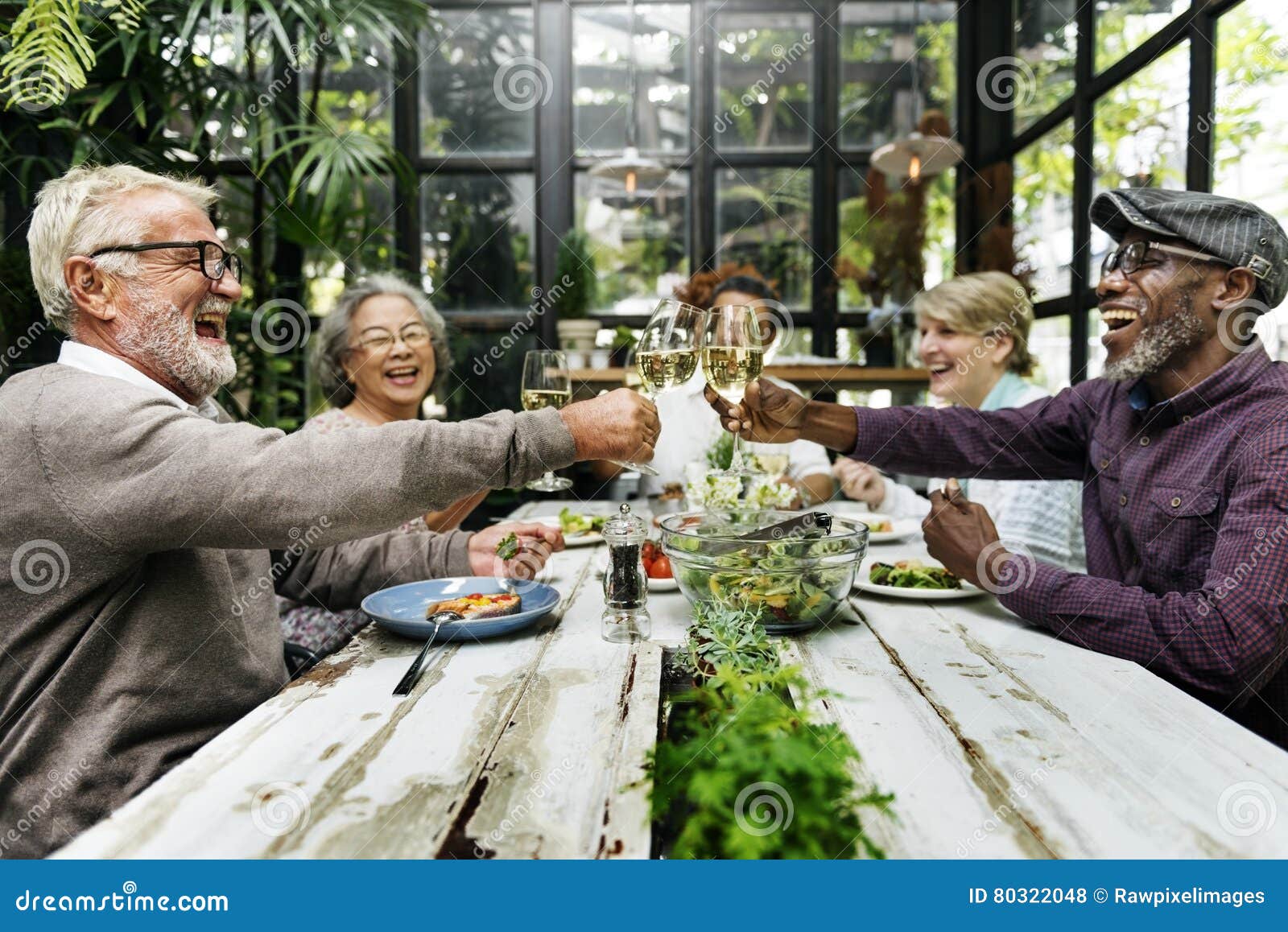 group of senior retirement meet up happiness concept