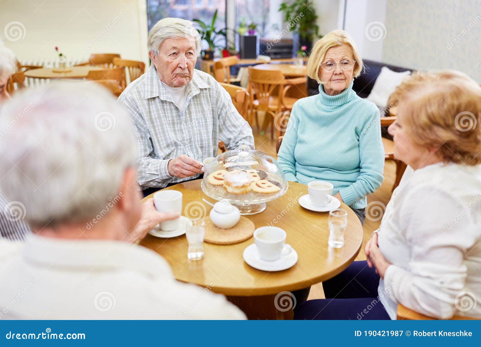 Group of Seniors Drinking Coffee at the Retirement Home Stock Image