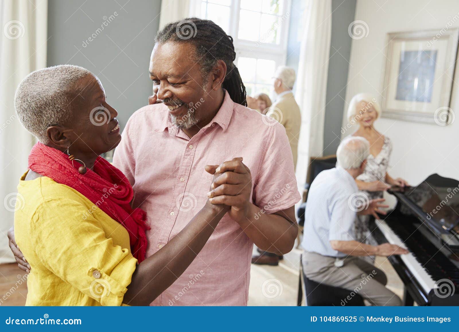 group of seniors enjoying dancing club together