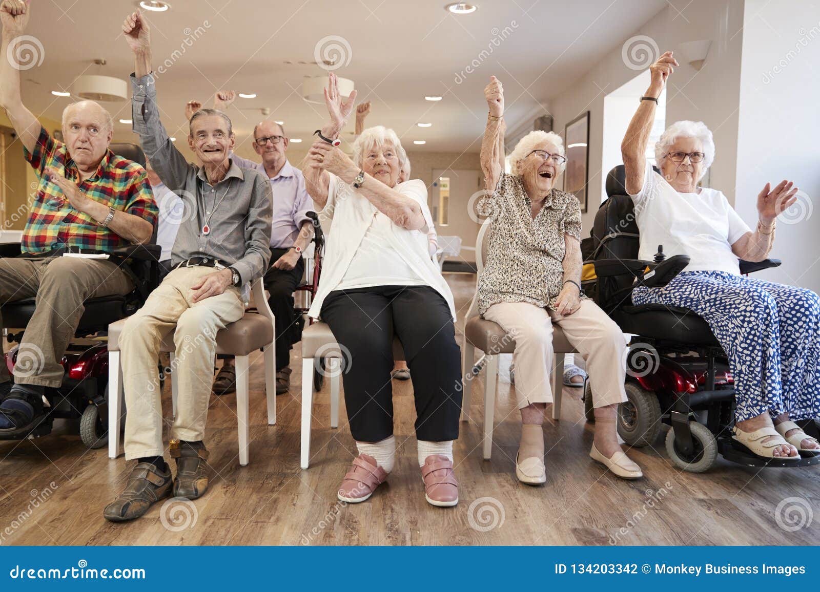 group of seniors enjoying fitness class in retirement home