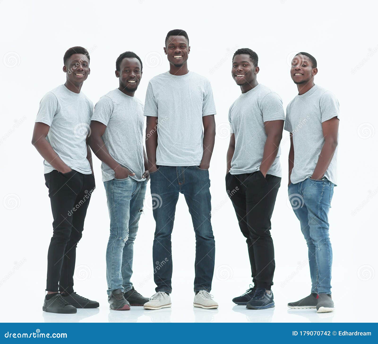 Group of Smiling Guys Standing Together. Isolated on White Stock Photo