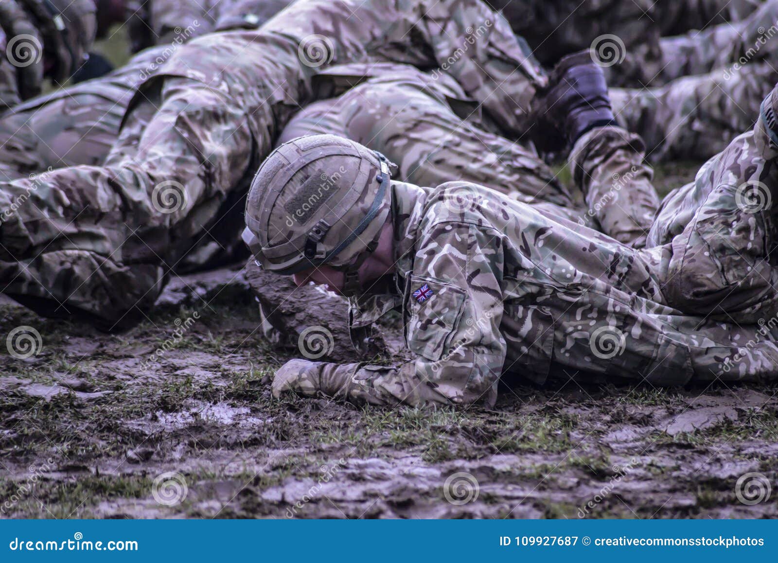 Group Of Soldiers Crawling On Mud Picture. Image 109927687