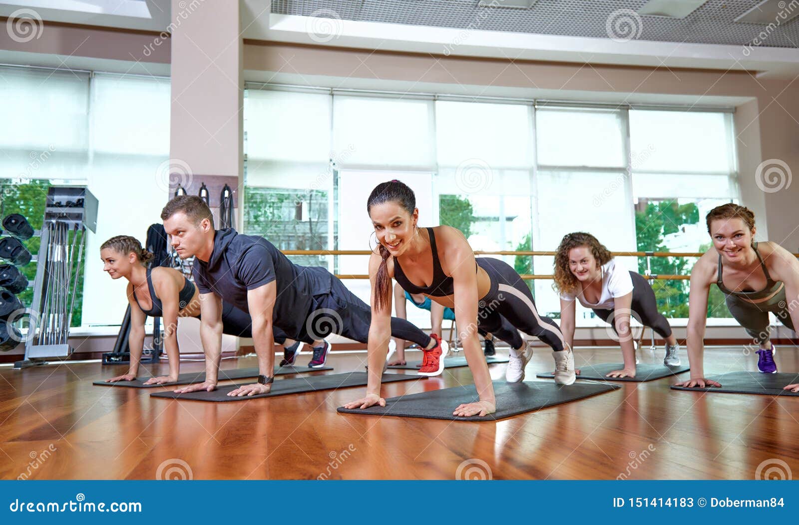 A Group Of Sporting Young People In Sportswear In A Fitness Room