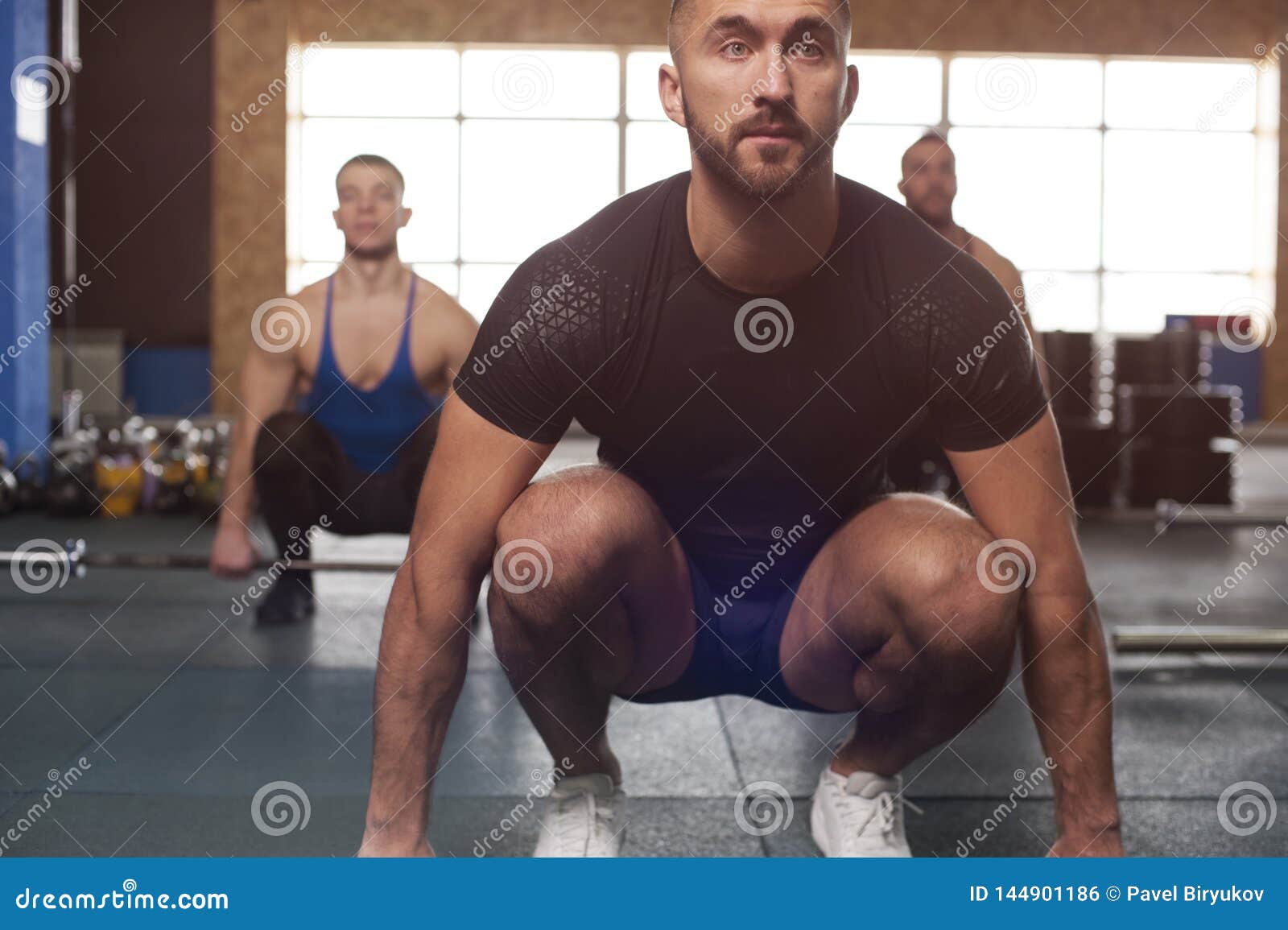 Group Of Sporty Athletic Men Training With Barbells. Stock Photo - Image of  athletic, endurance: 144901186