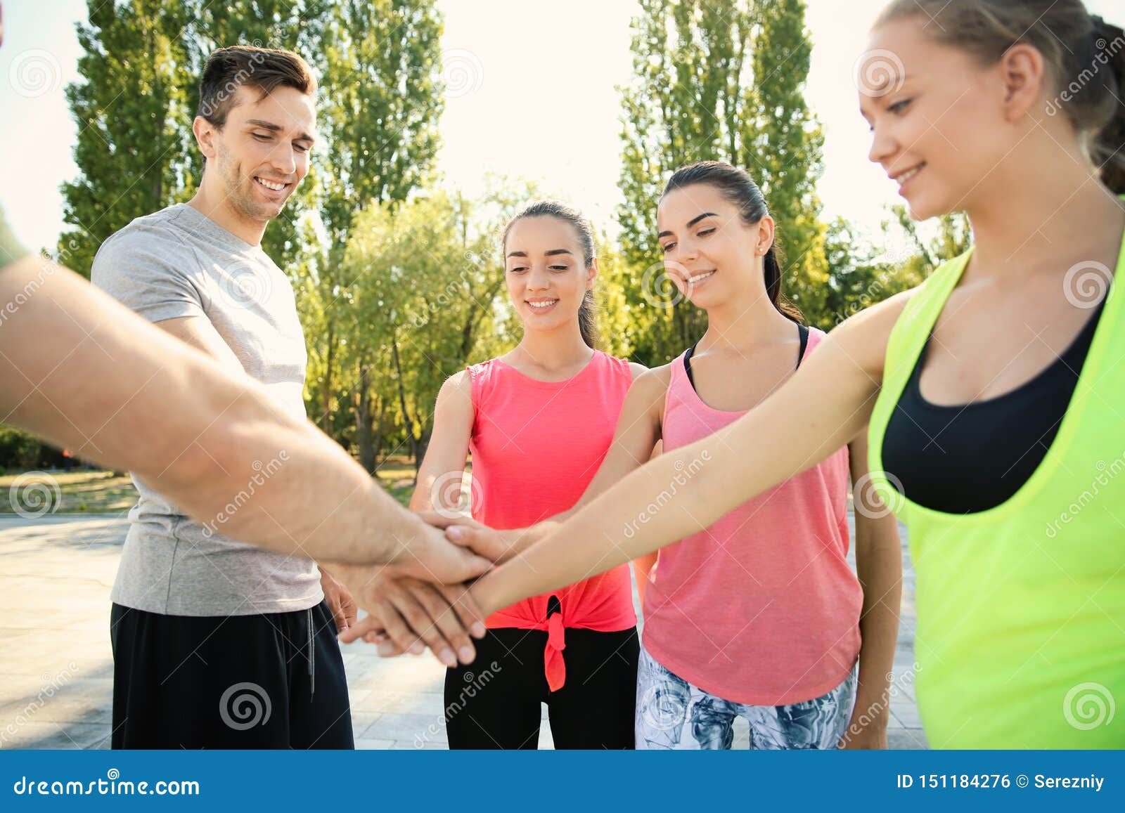 Group of Sporty People Putting Hands Together Outdoors Stock Photo ...