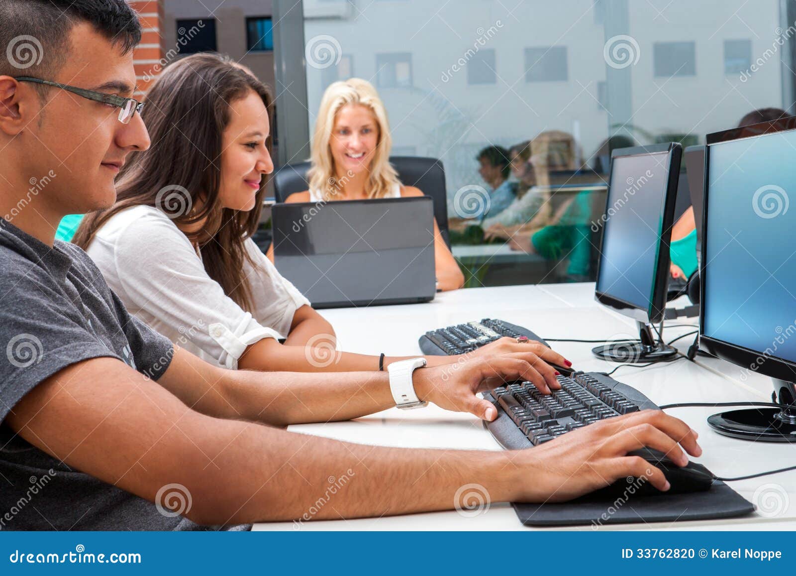 group of students training on computers.