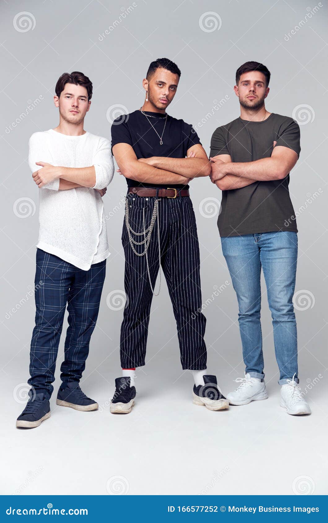 Group Studio Portrait Of MultiCultural Male Friends Looking Into
