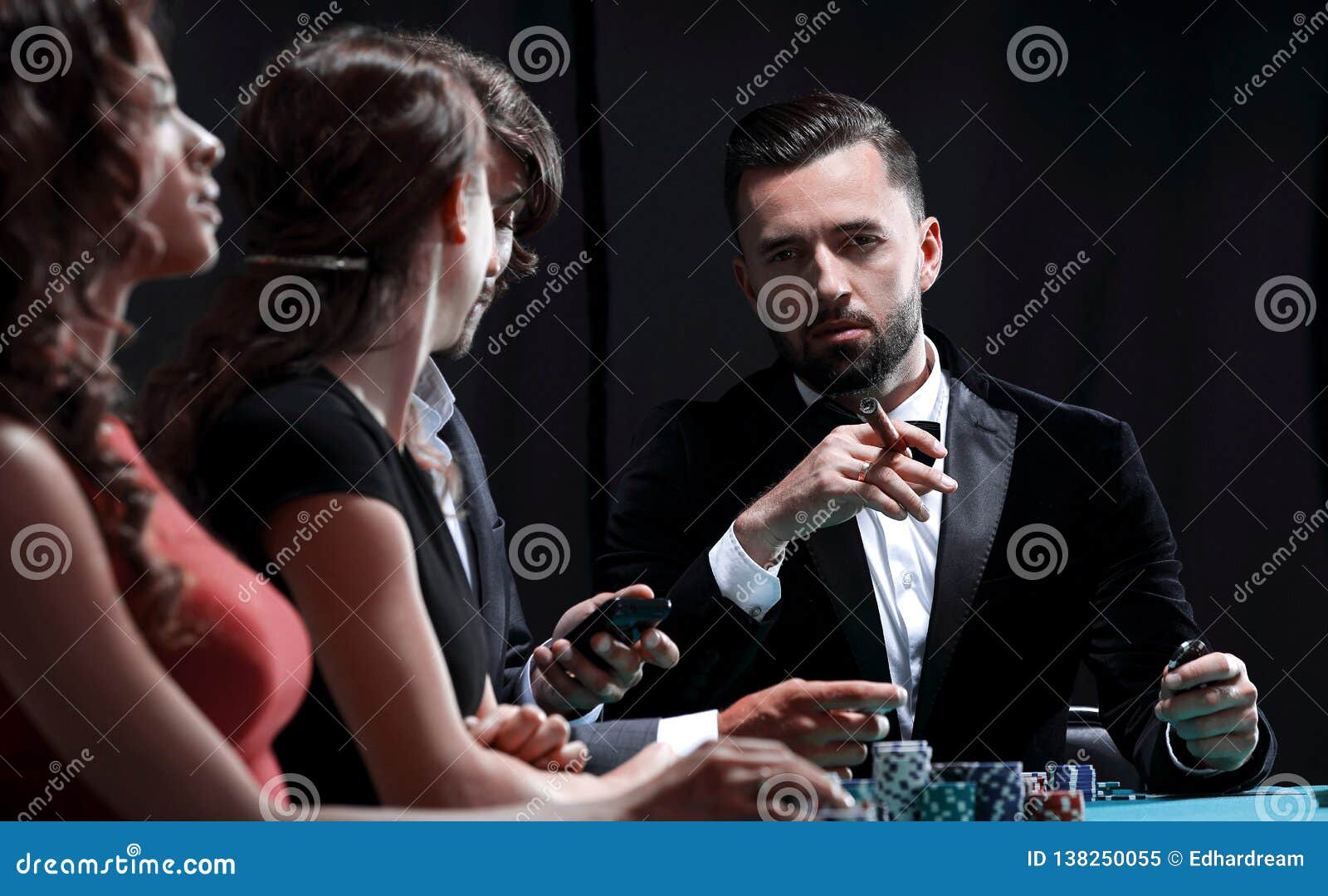People enjoying a night out gambling at the casino