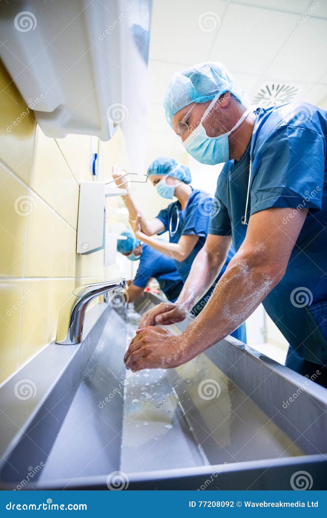 Group of Surgeons Washing Their Hands at Washbasin Stock Photo Image