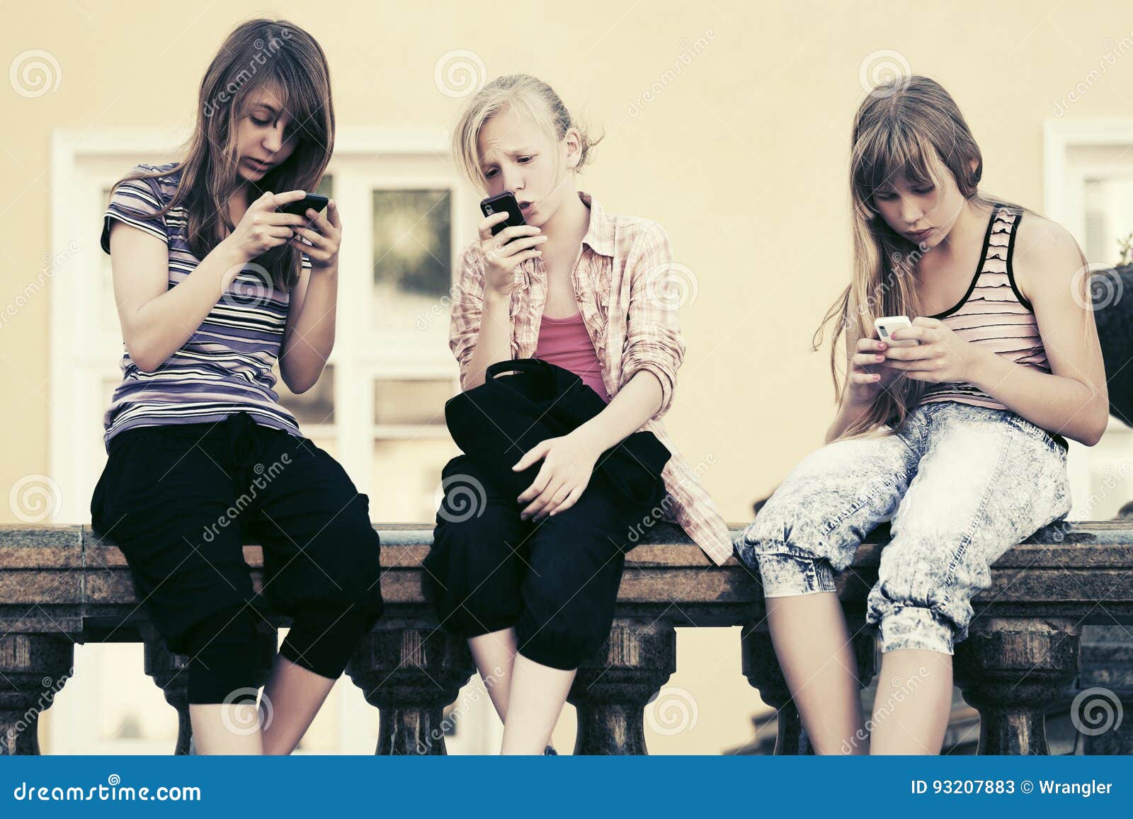 group of teen girls calling on cell phones